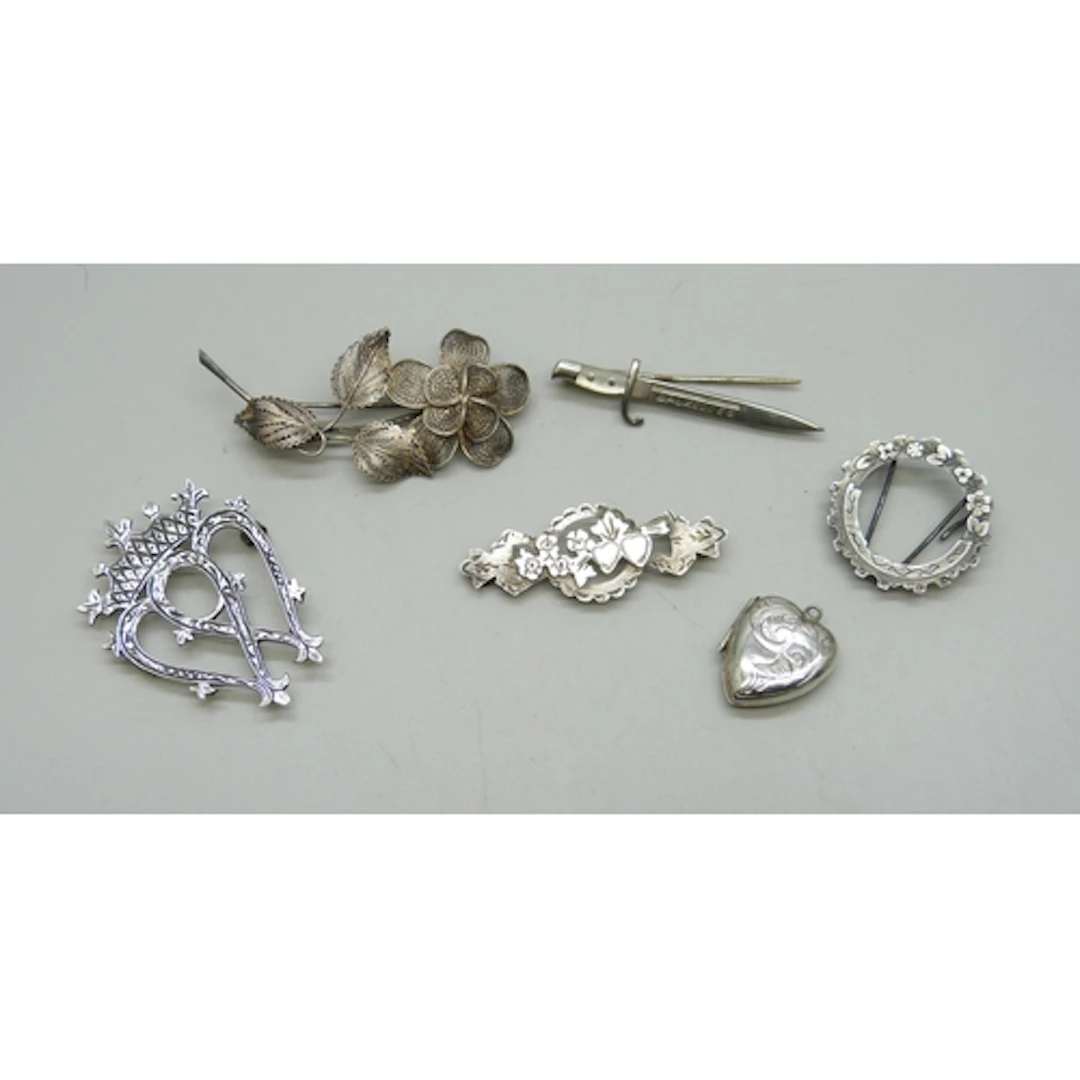 A collection of silver and white metal jewellery including a...