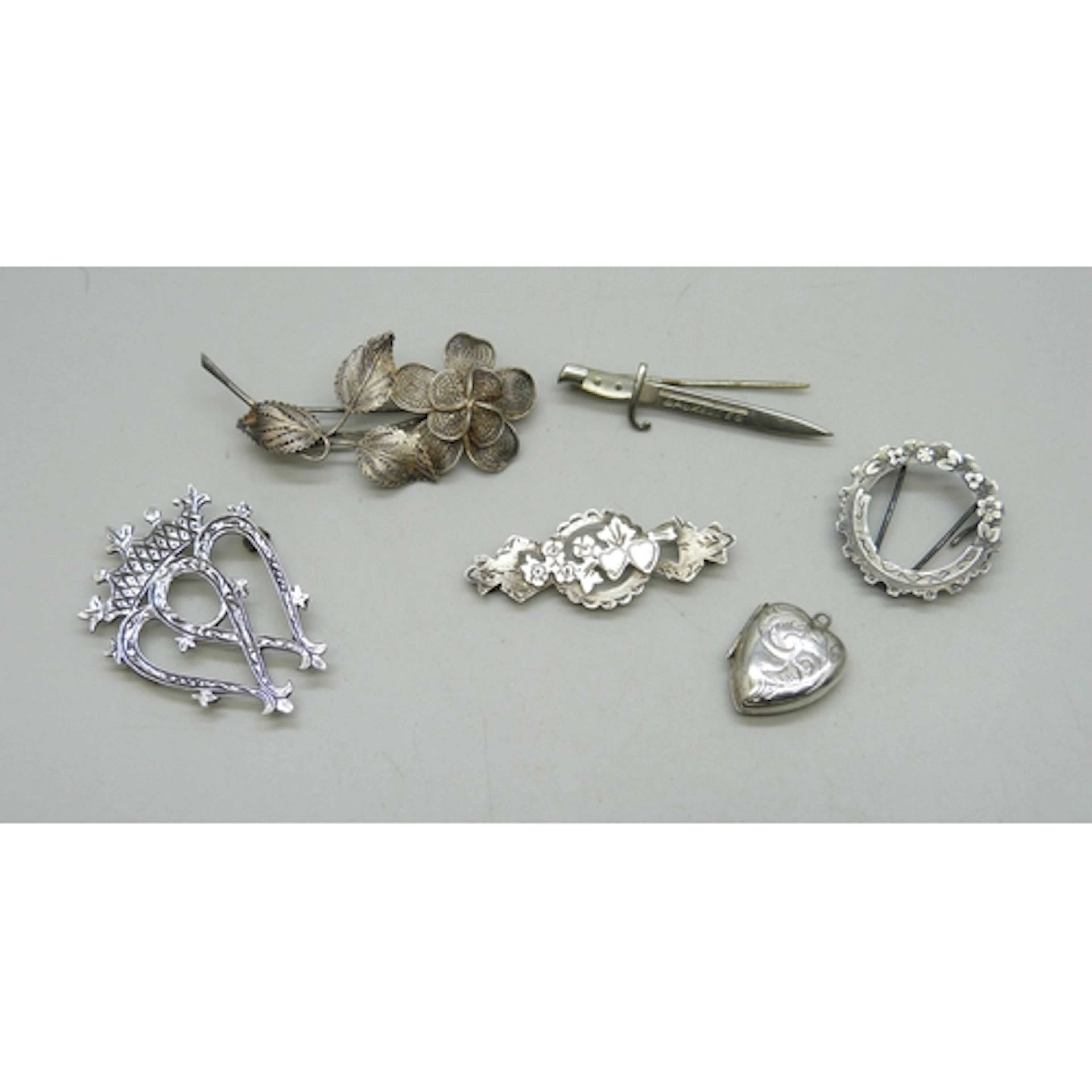 A collection of silver and white metal jewellery including a...