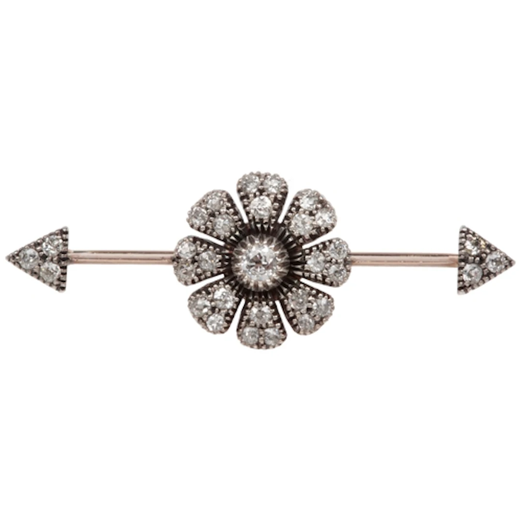 A diamond bar brooch, late 19th century, centring on a flora...