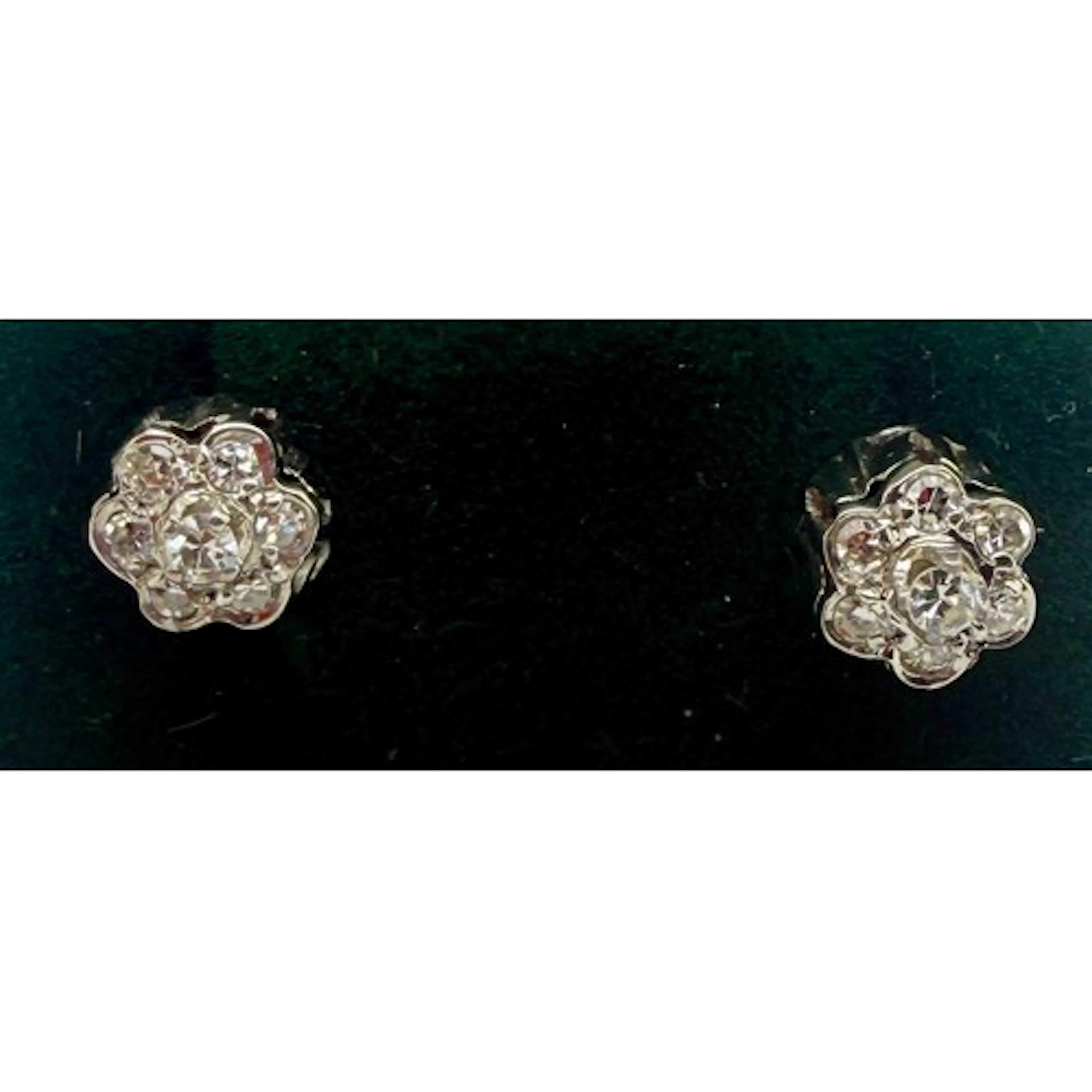 A pair of 18 carat white gold and diamond cluster earrings. ...