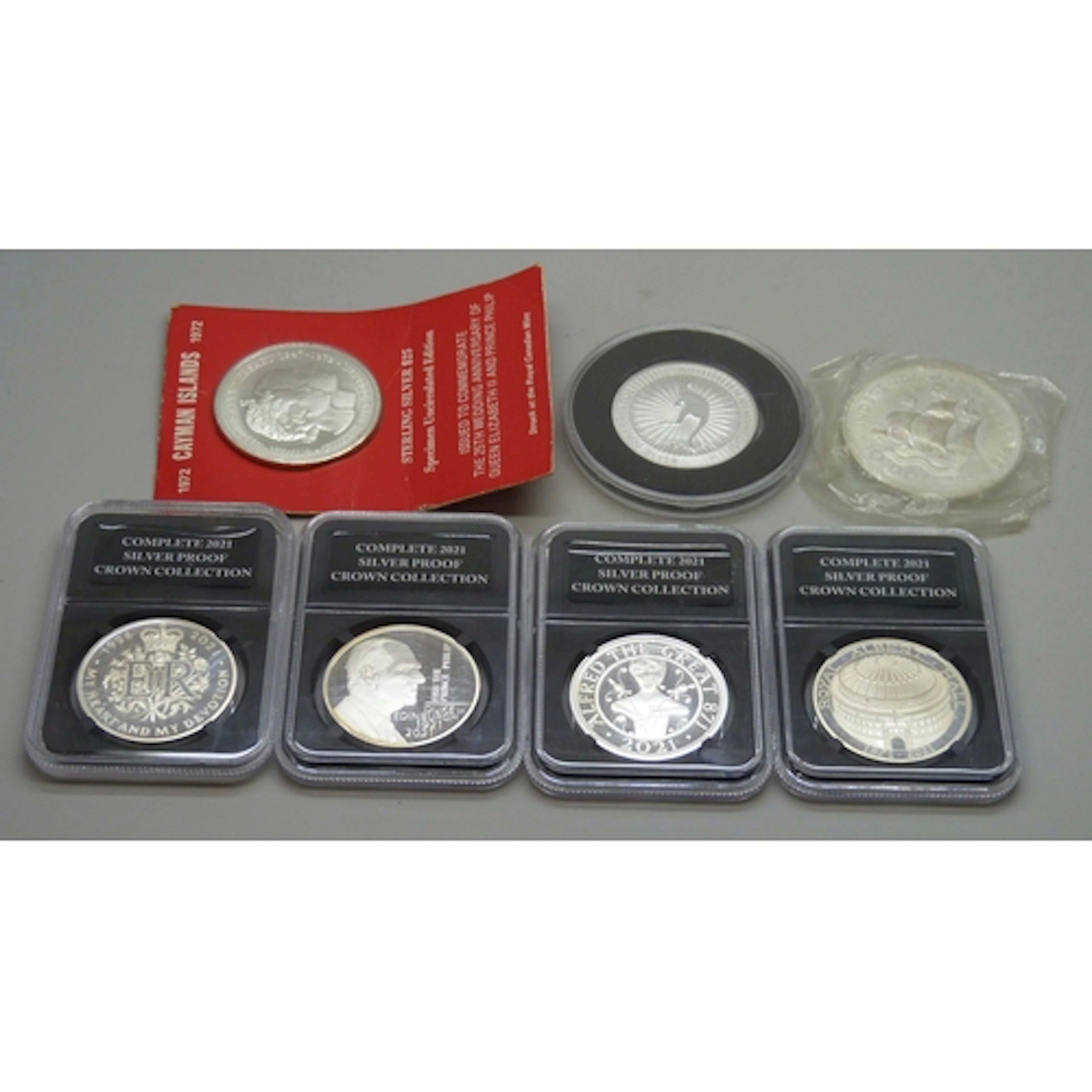 Coins - a Cayman Islands $25 silver coin, a Commonwealth of ...