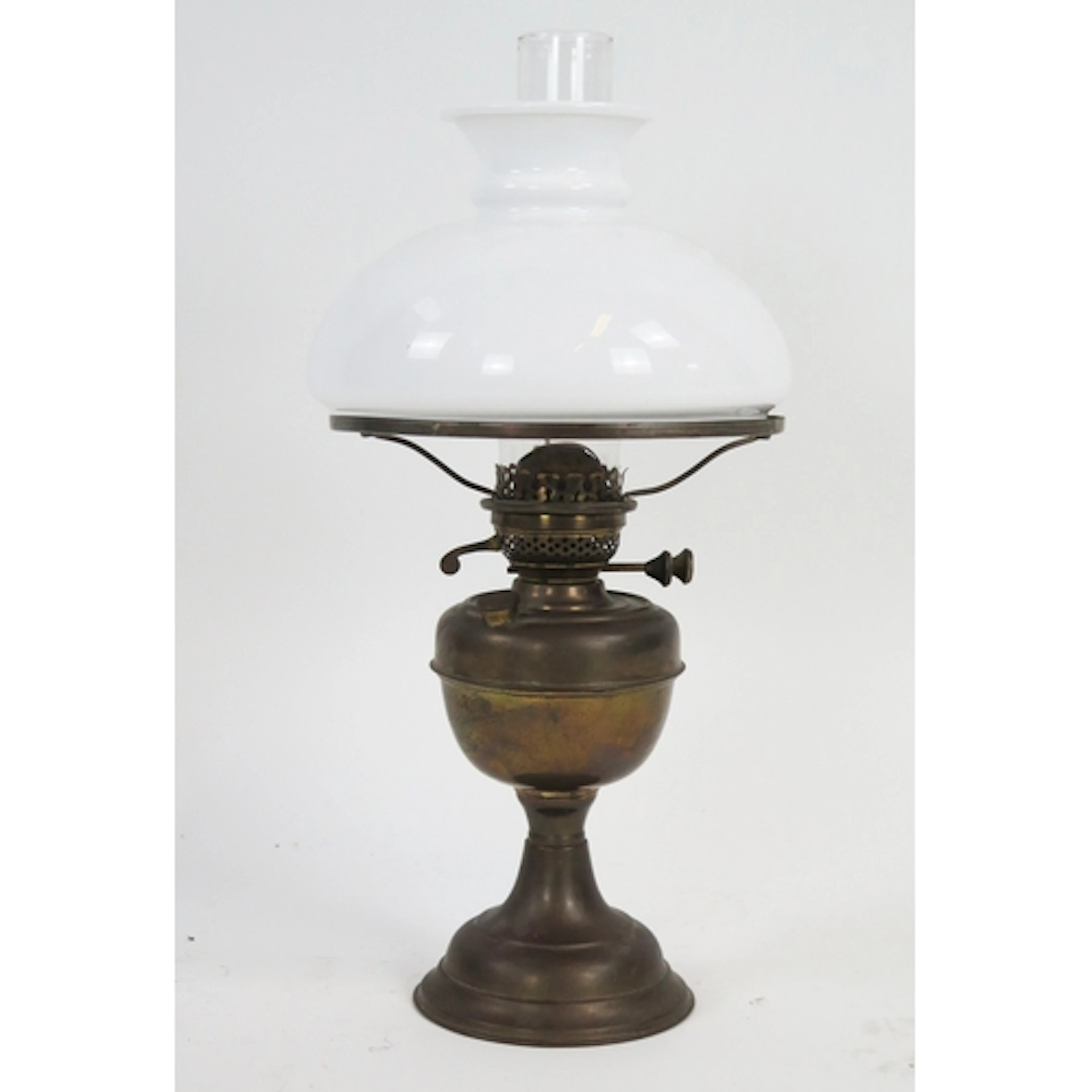 A Brass oil lamp, with milk glass shade, and clear glass chi...