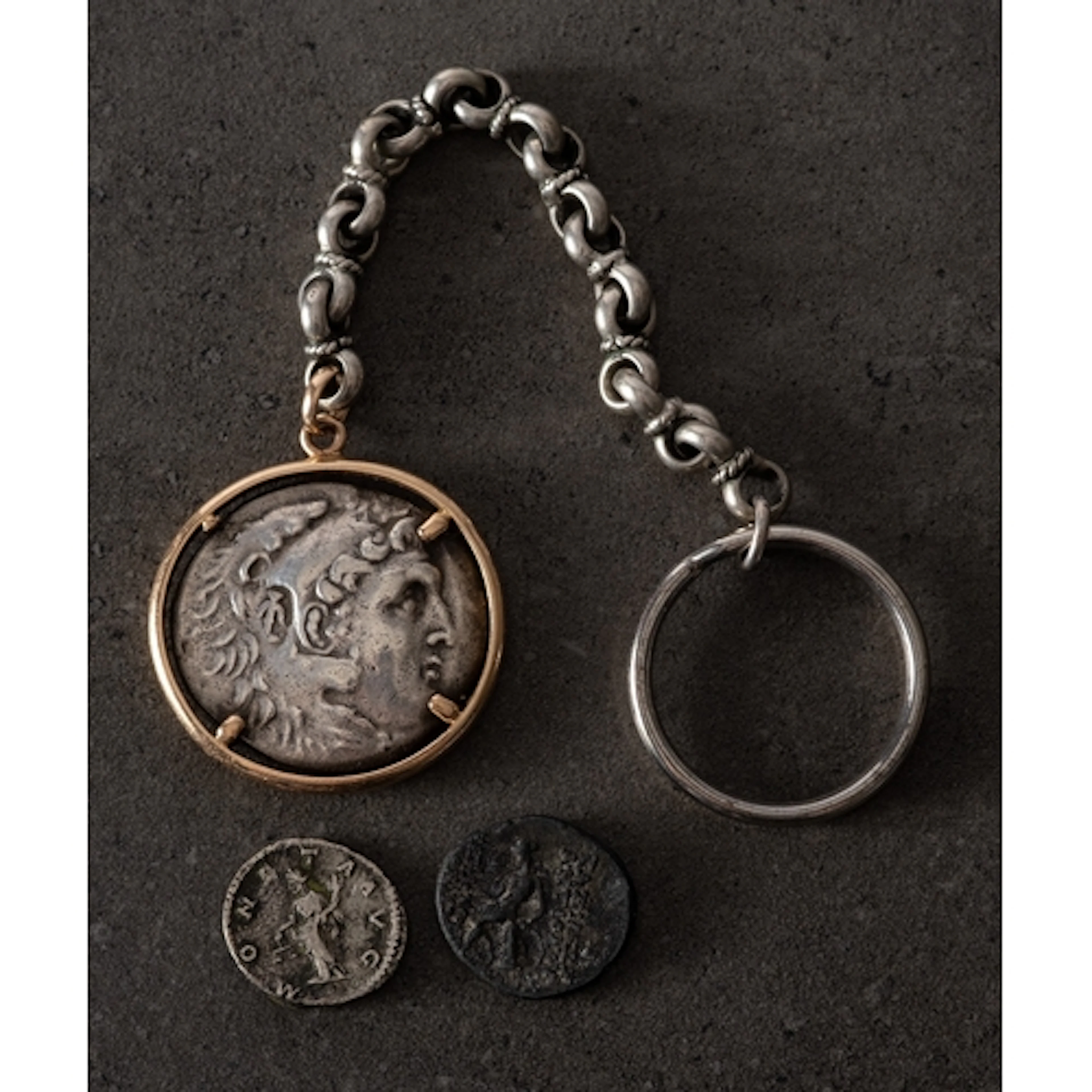 An Alexander the Great tetradrachm set in a yellow metal pen...