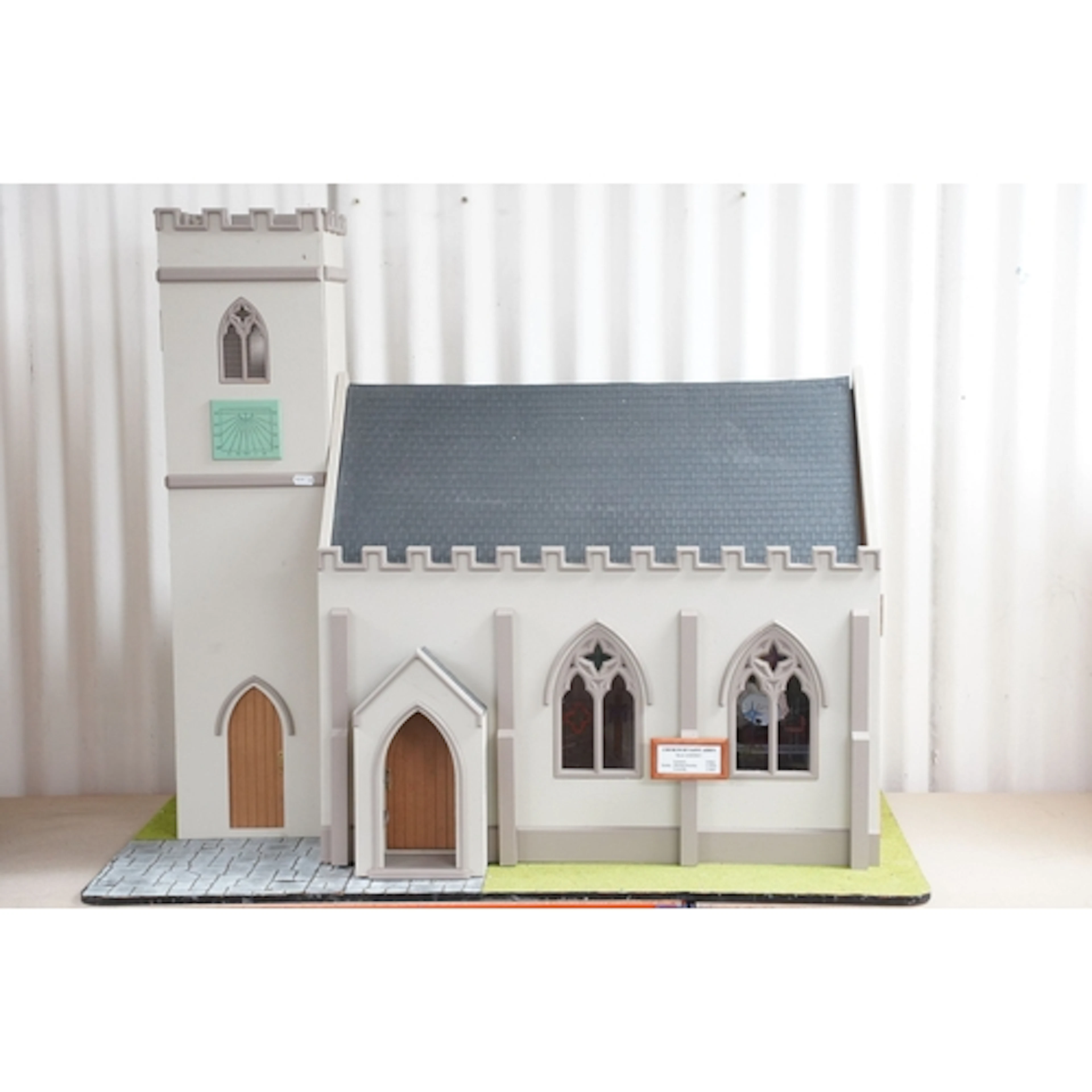 Large contemporary dolls house in the form a church with ope...