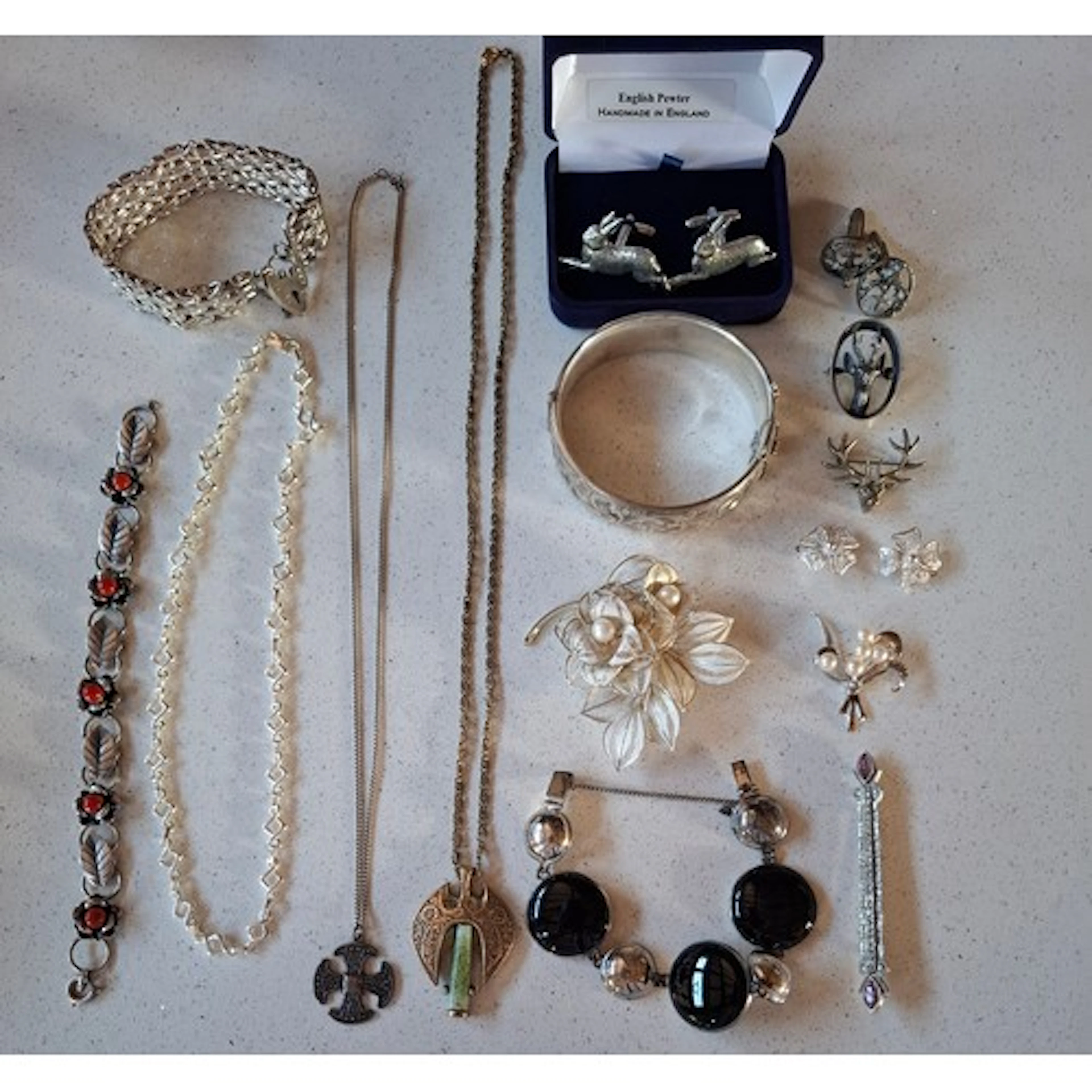 A quantity of silver and silver tone costume jewellery to in...