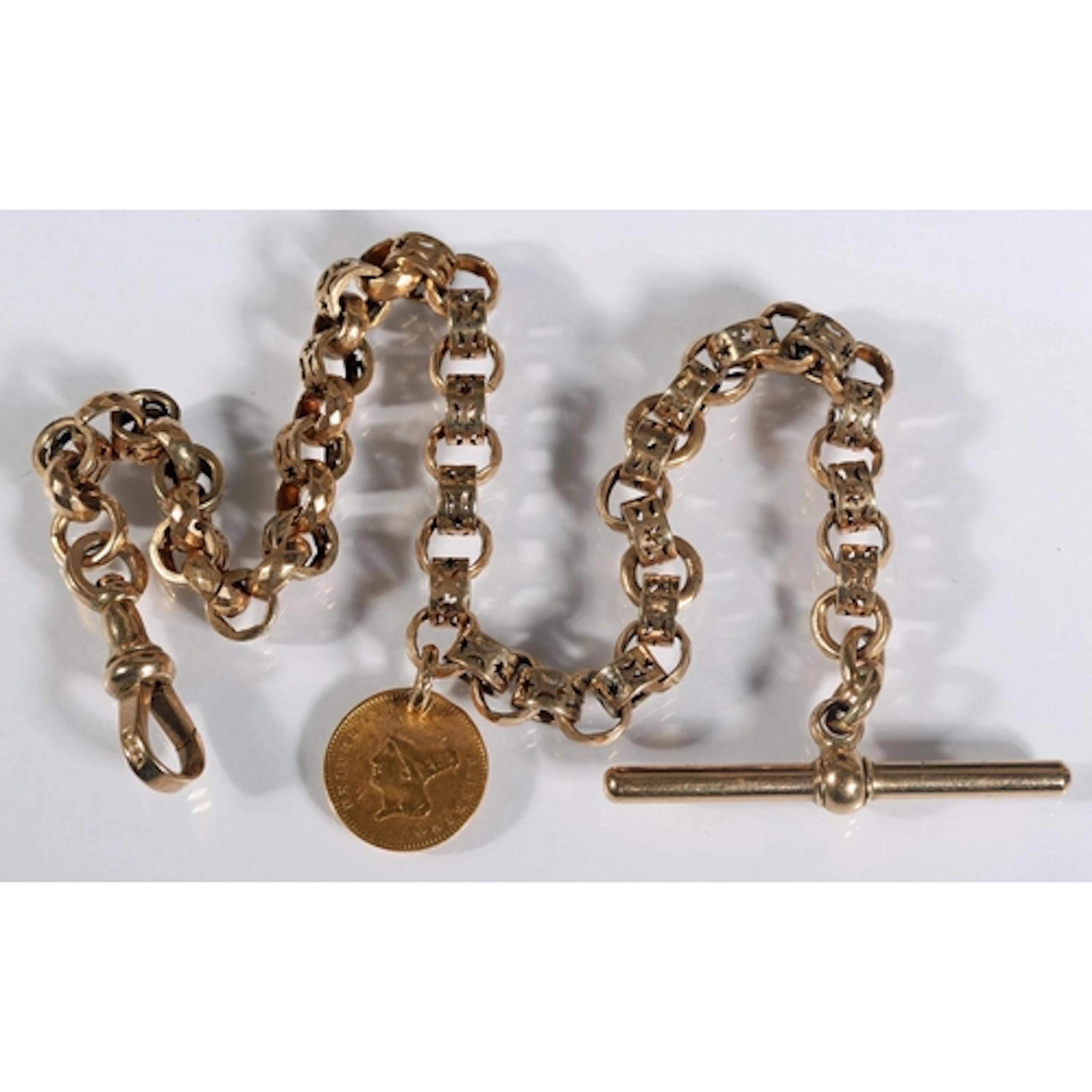 Gold tone watch guard chain formed of pierced ring and belch...