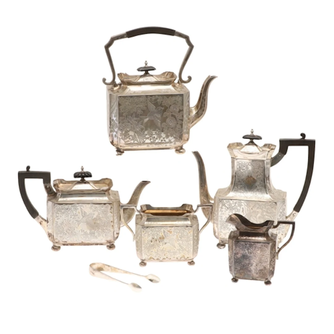 A LATE VICTORIAN AESTHETIC MOVEMENT FIVE PIECE SILVER TEA SE...