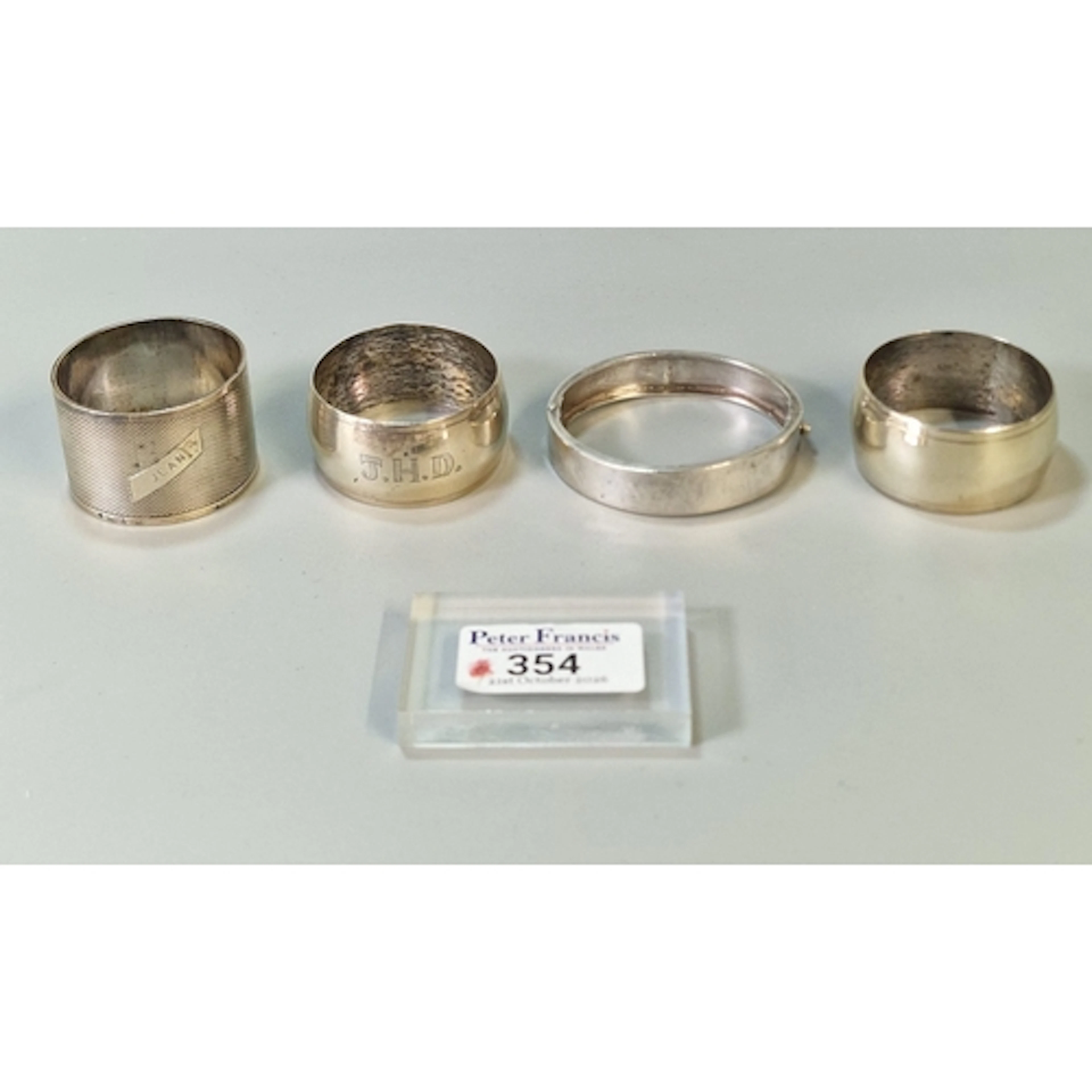 Silver engraved foliate bangle (0.6 troy oz approx.), togeth...