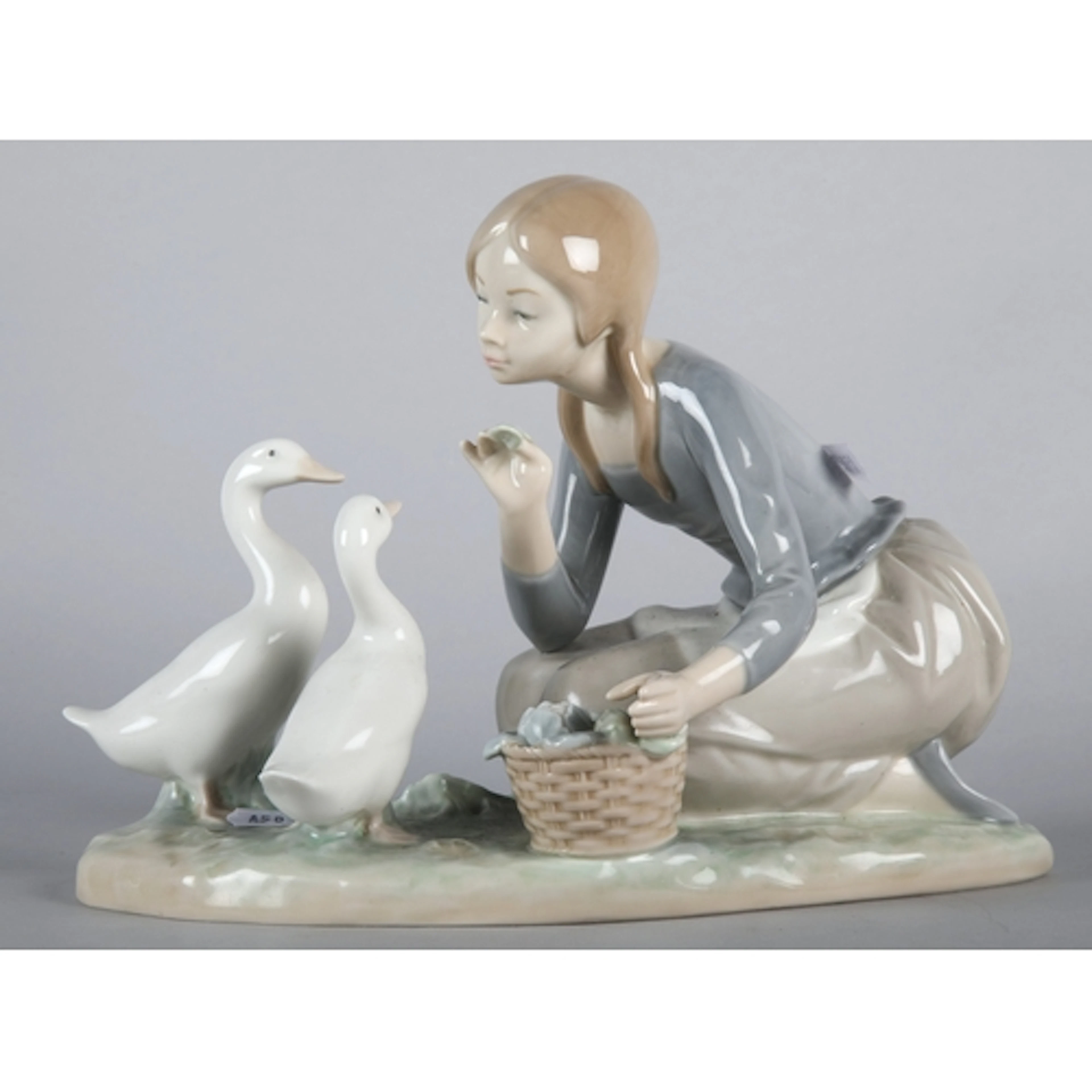Lladro figure of a girl feeding swans, approx 23cm L.