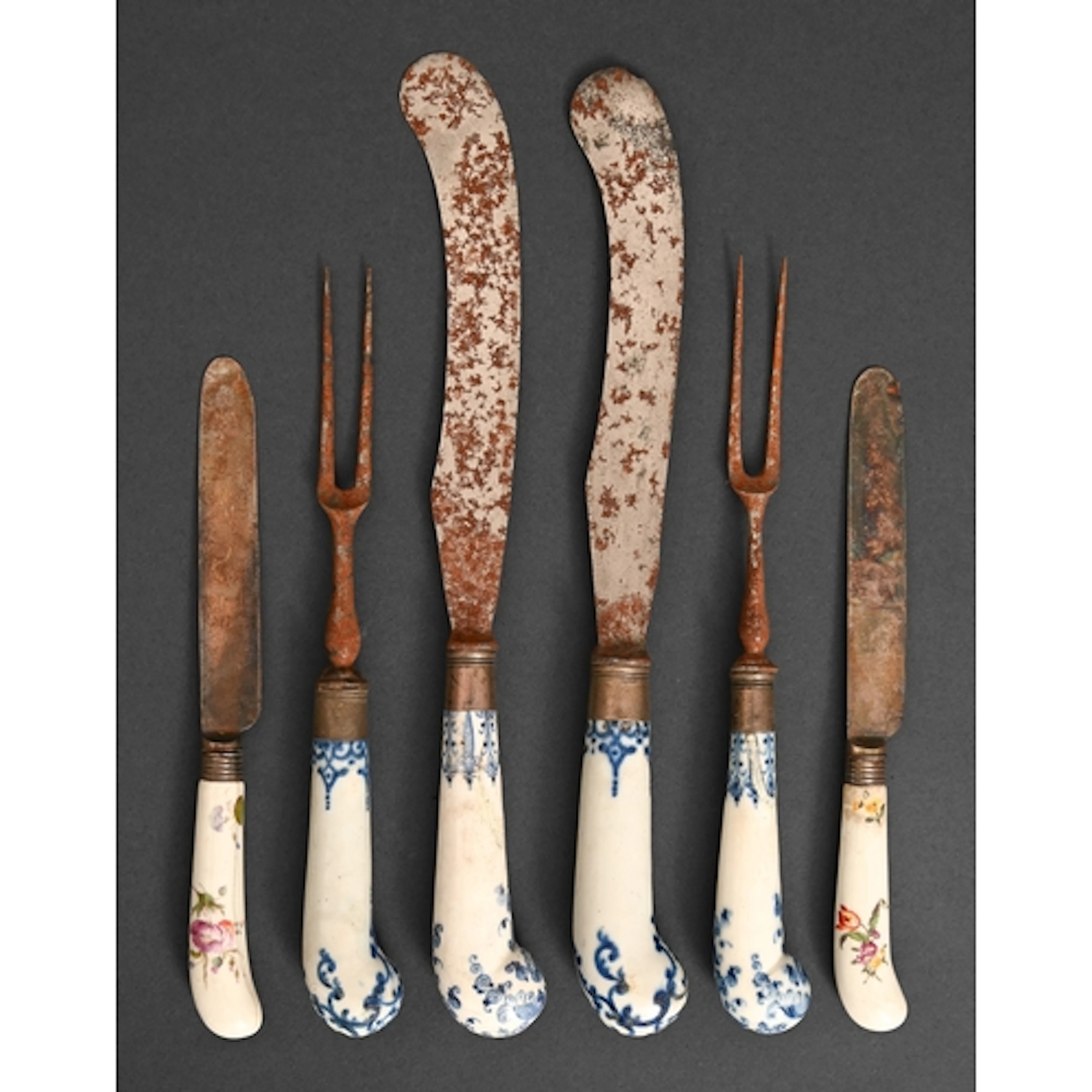 A St Cloud pistol-hafted steel knife and fork, c1750, painte...