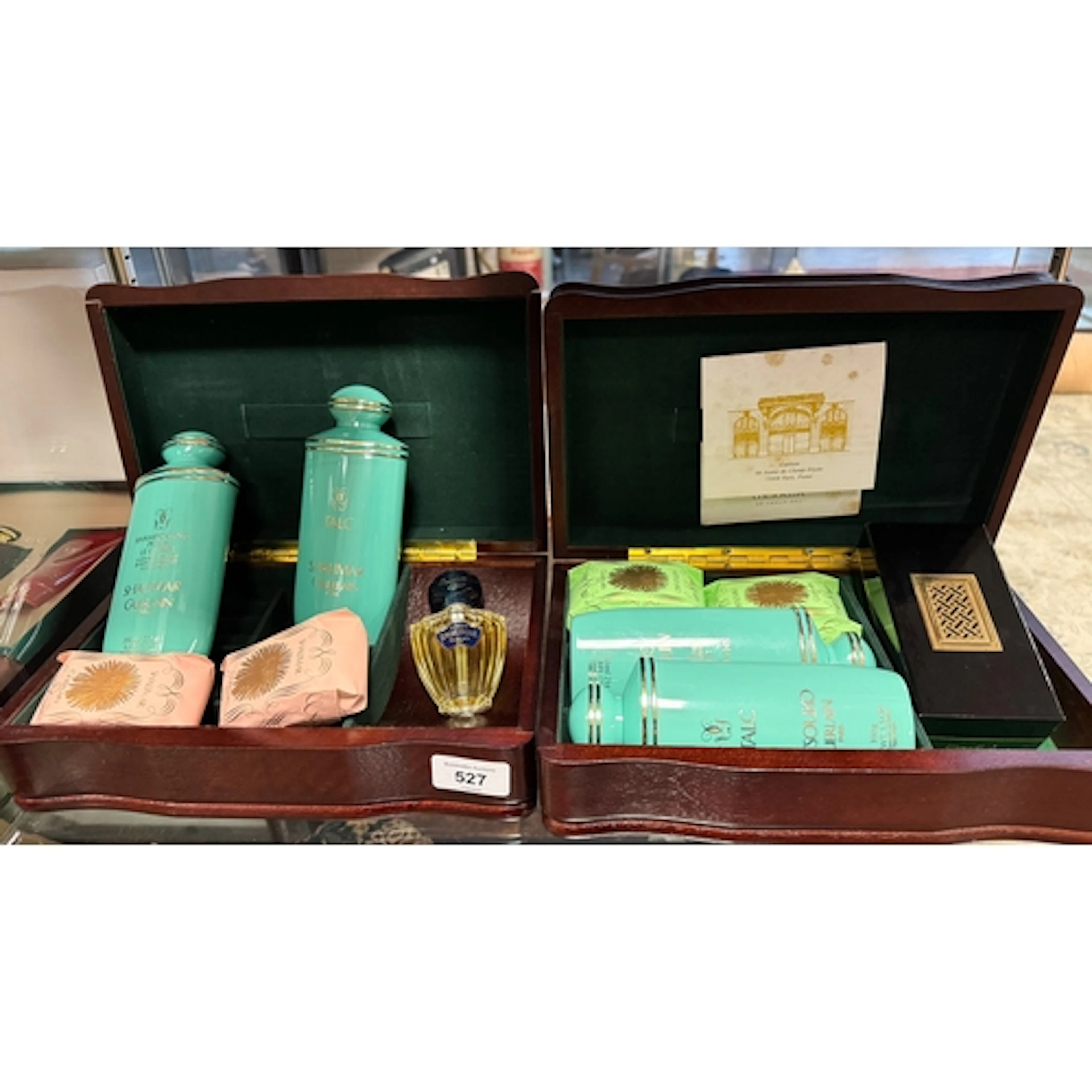 Guerlain - two wooden jewellery boxes containing Shalimar an...