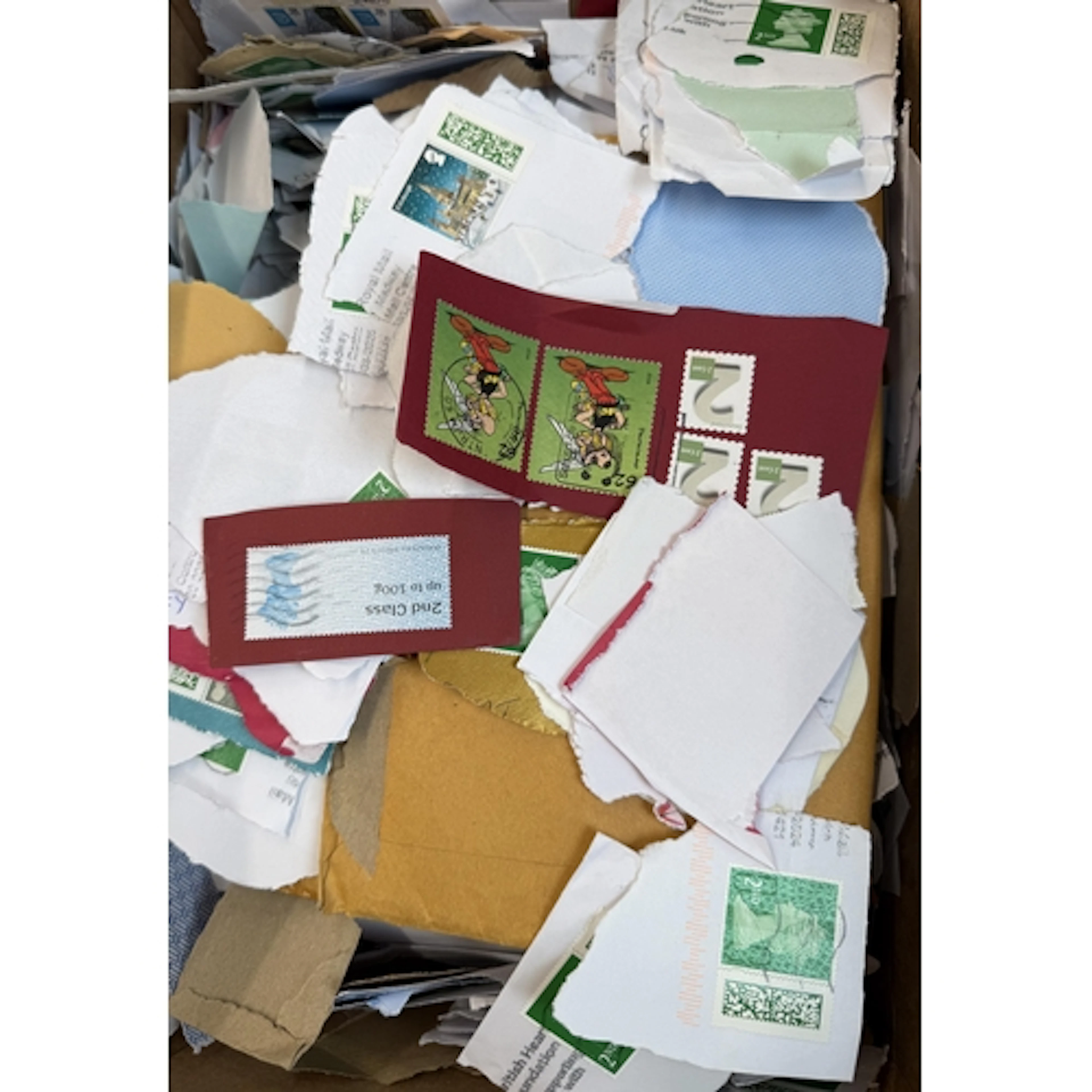 An accumulation of UK modern stamp kiloware (on piece), weig...