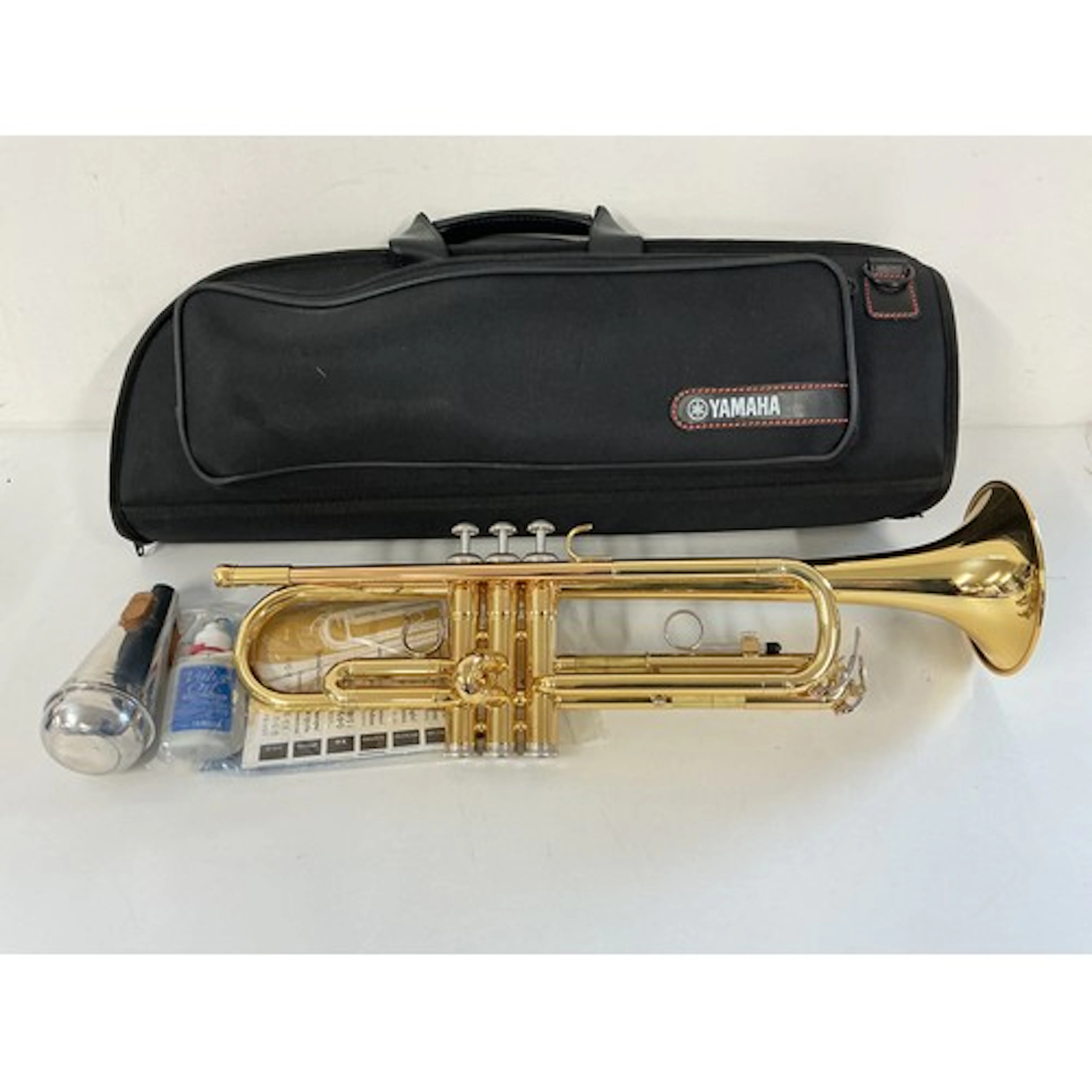 A cased Yamaha trumpet and accessories.