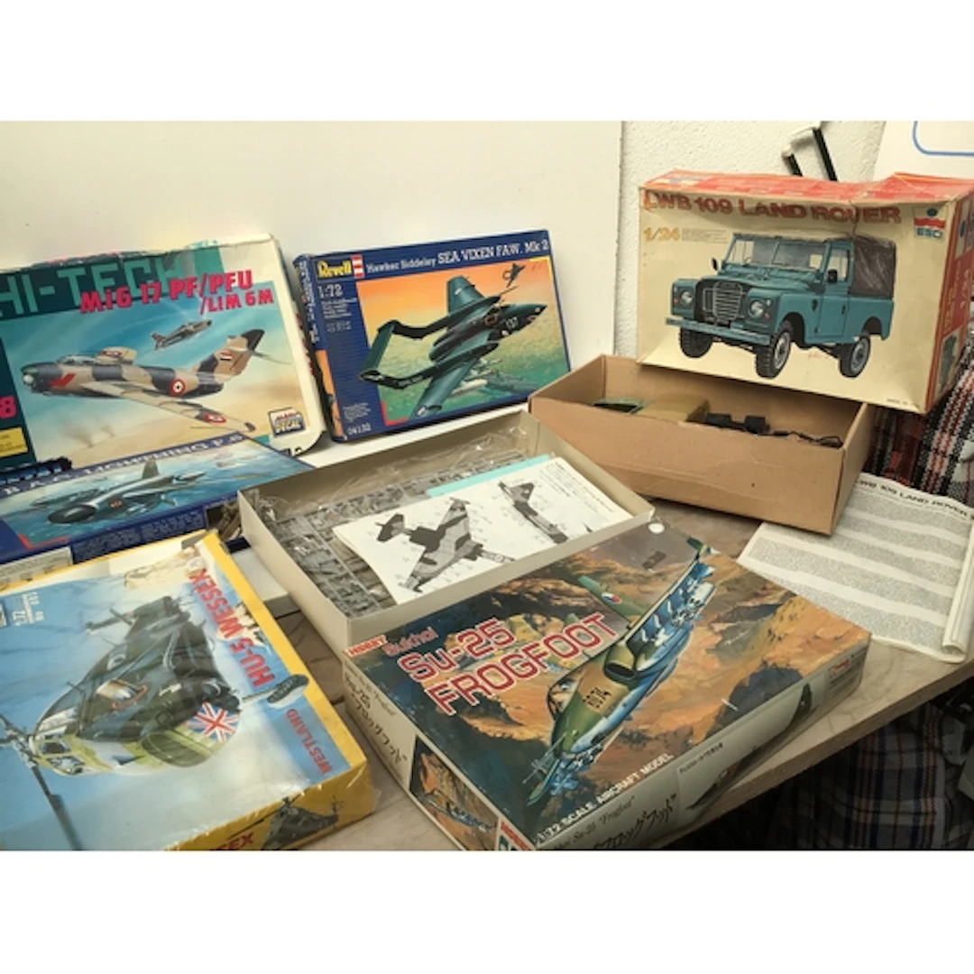 Boxed collection of model aircraft and cars in a various sca...