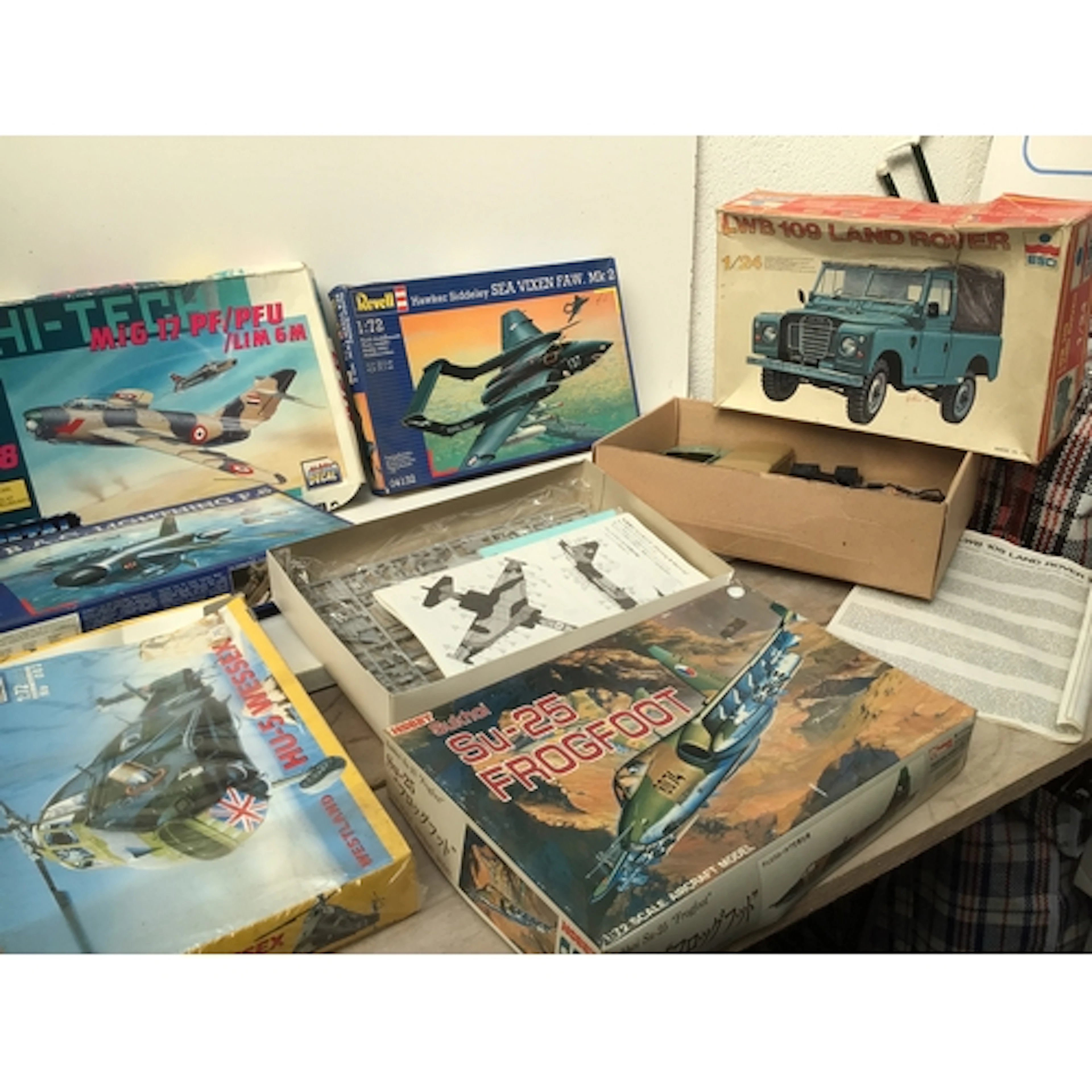 Boxed collection of model aircraft and cars in a various sca...