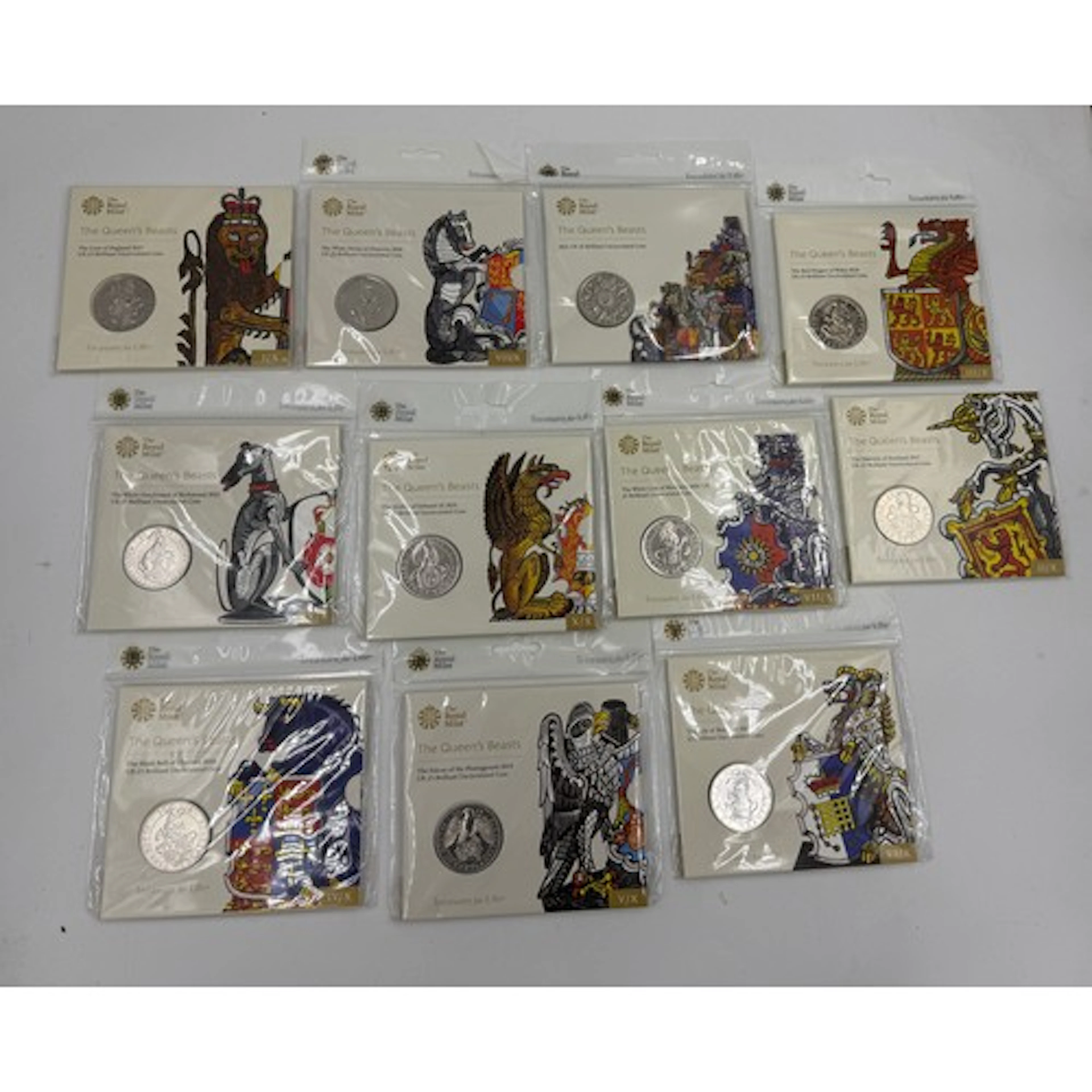Royal Mint, eleven £5 Uncirculated Coin Sets comprising The ...