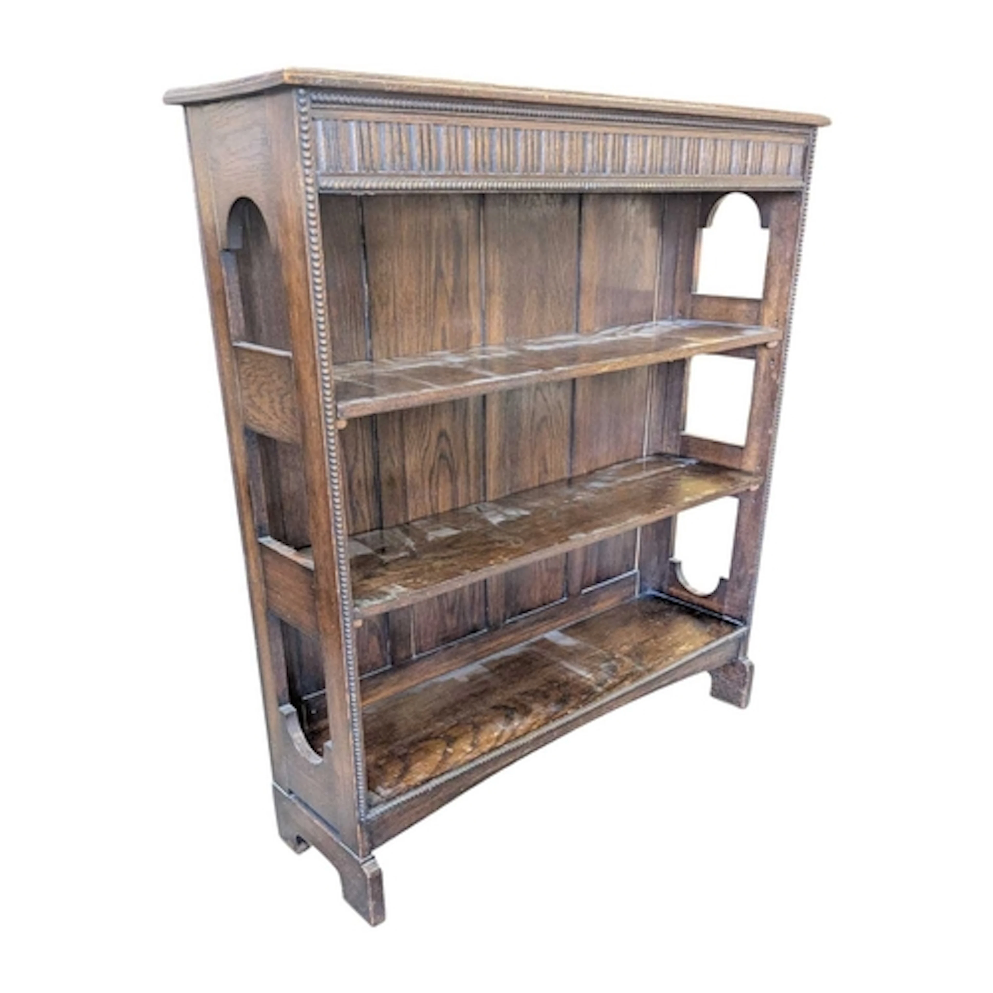 An early 20th century Jacobean revival oak open window bookc...