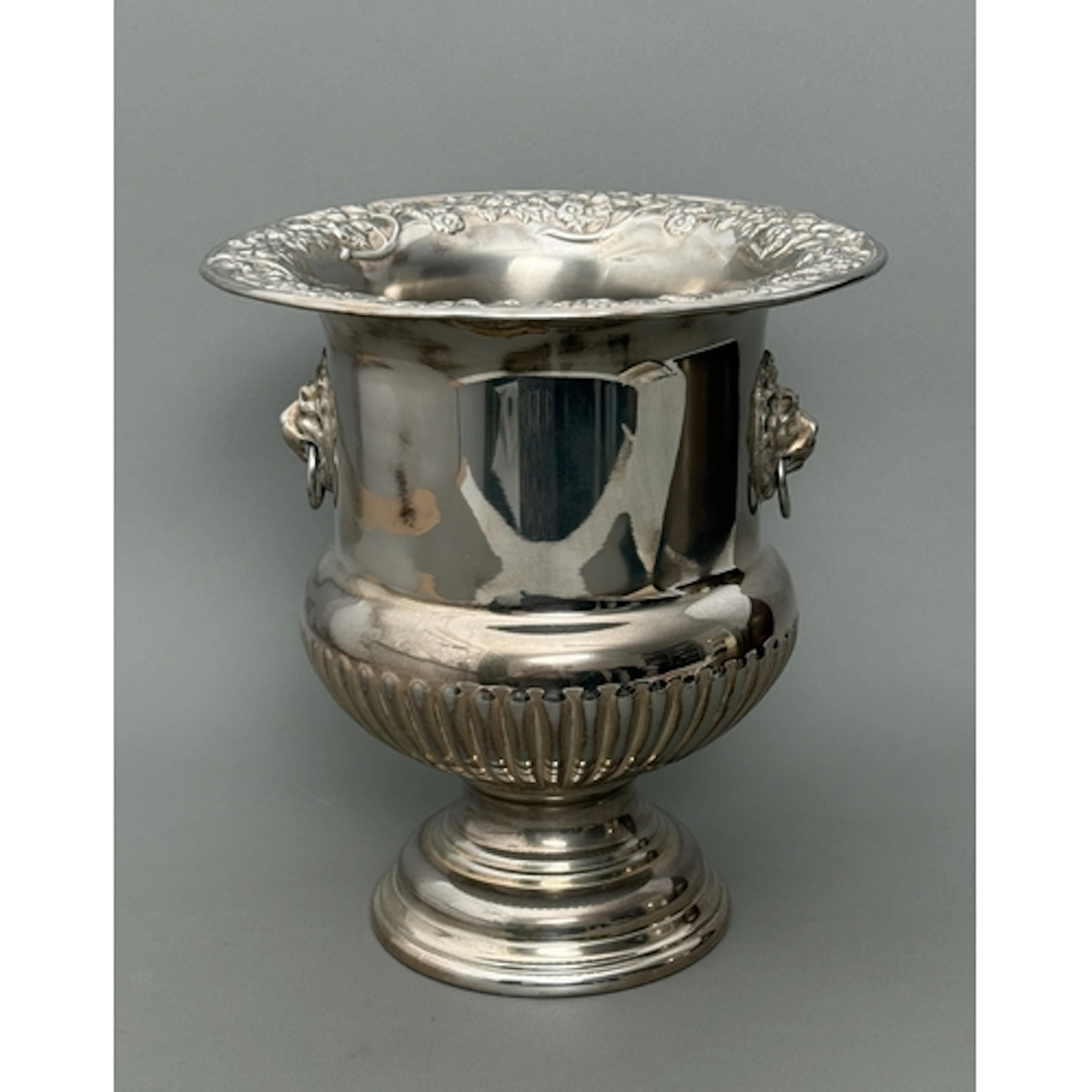 A silver plated champagne ice bucket - urn shaped and raised...