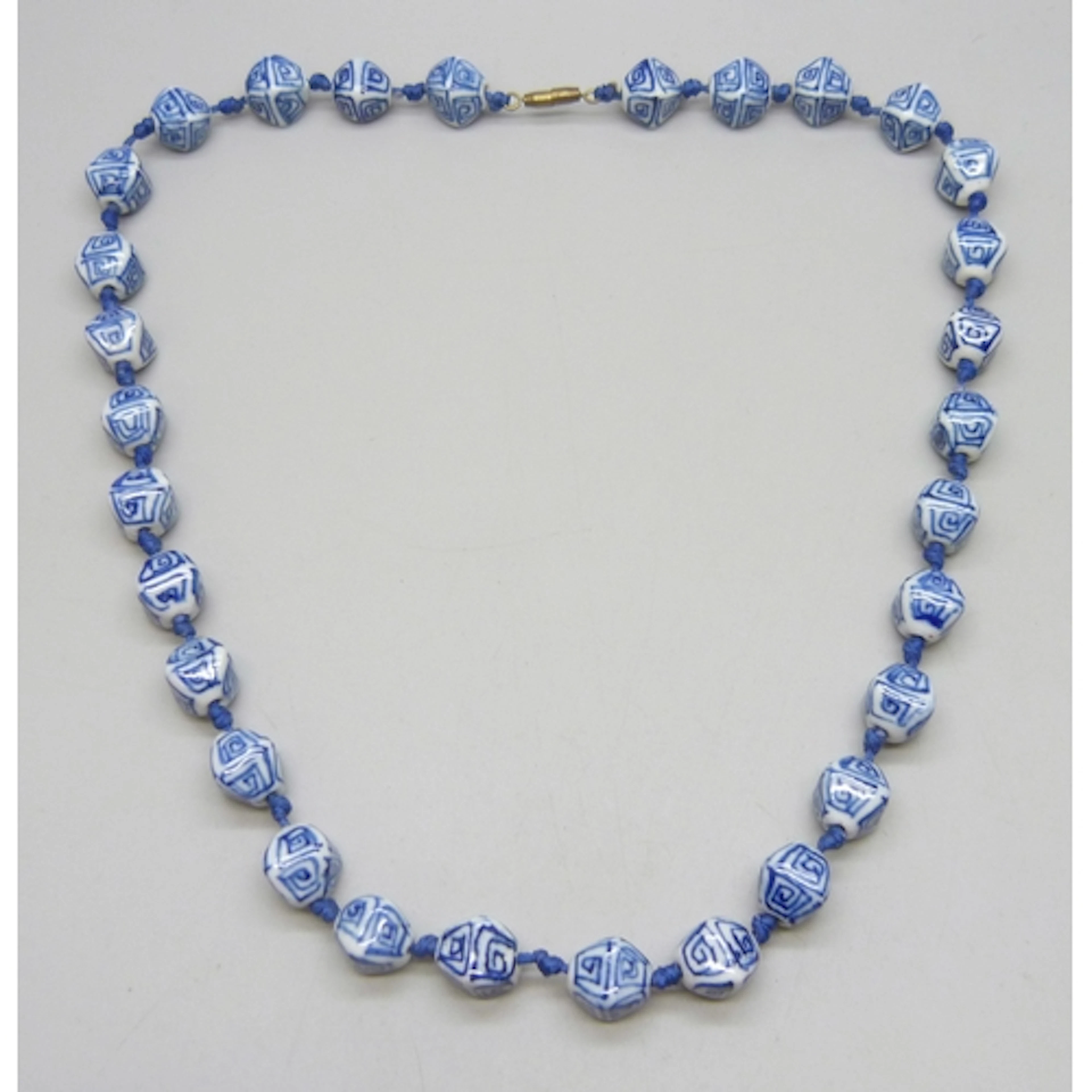 A vintage Chinese blue and white ceramic bead necklace, 51cm