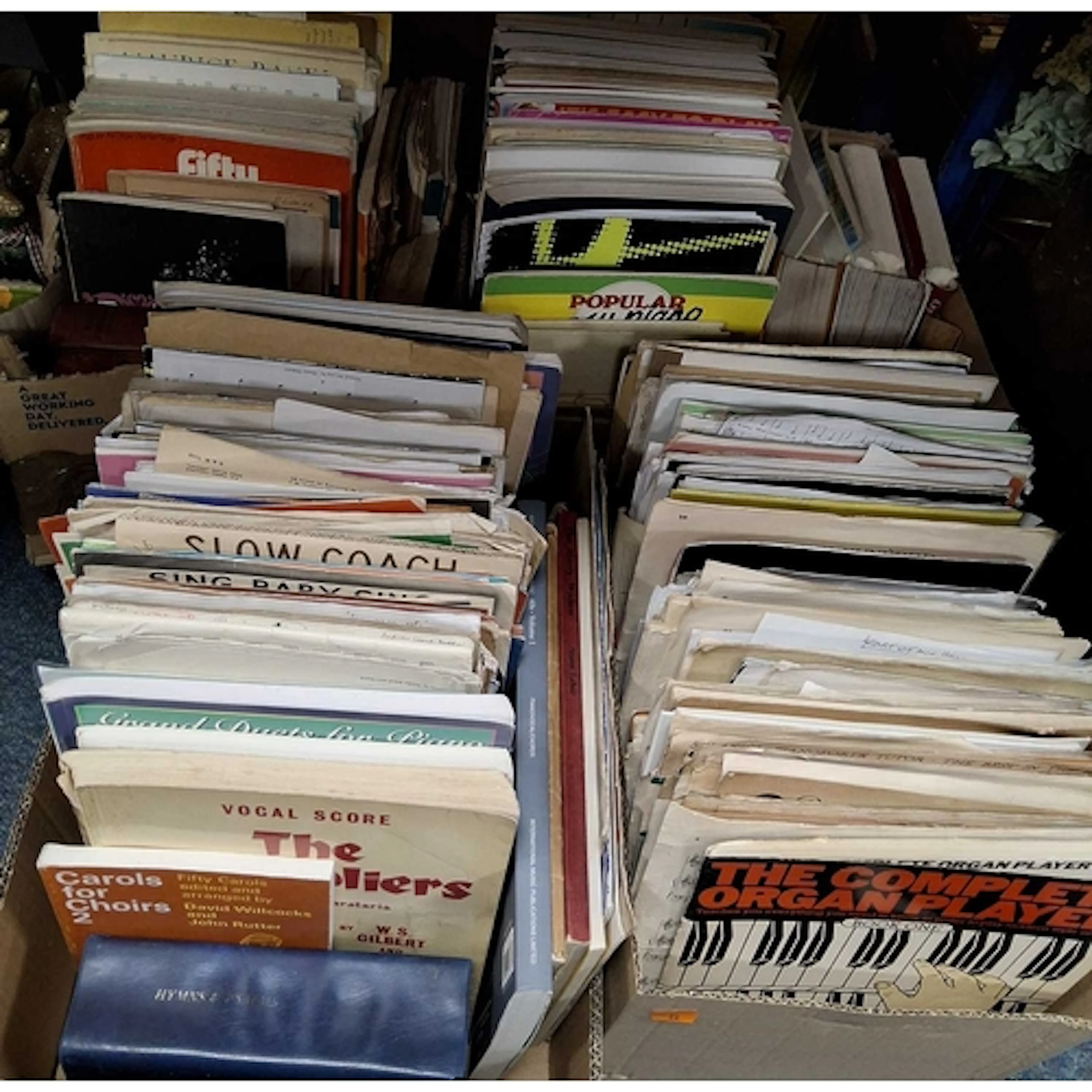 FOUR BOXES OF MUSIC BOOKS AND SHEET MUSIC, to included a var...