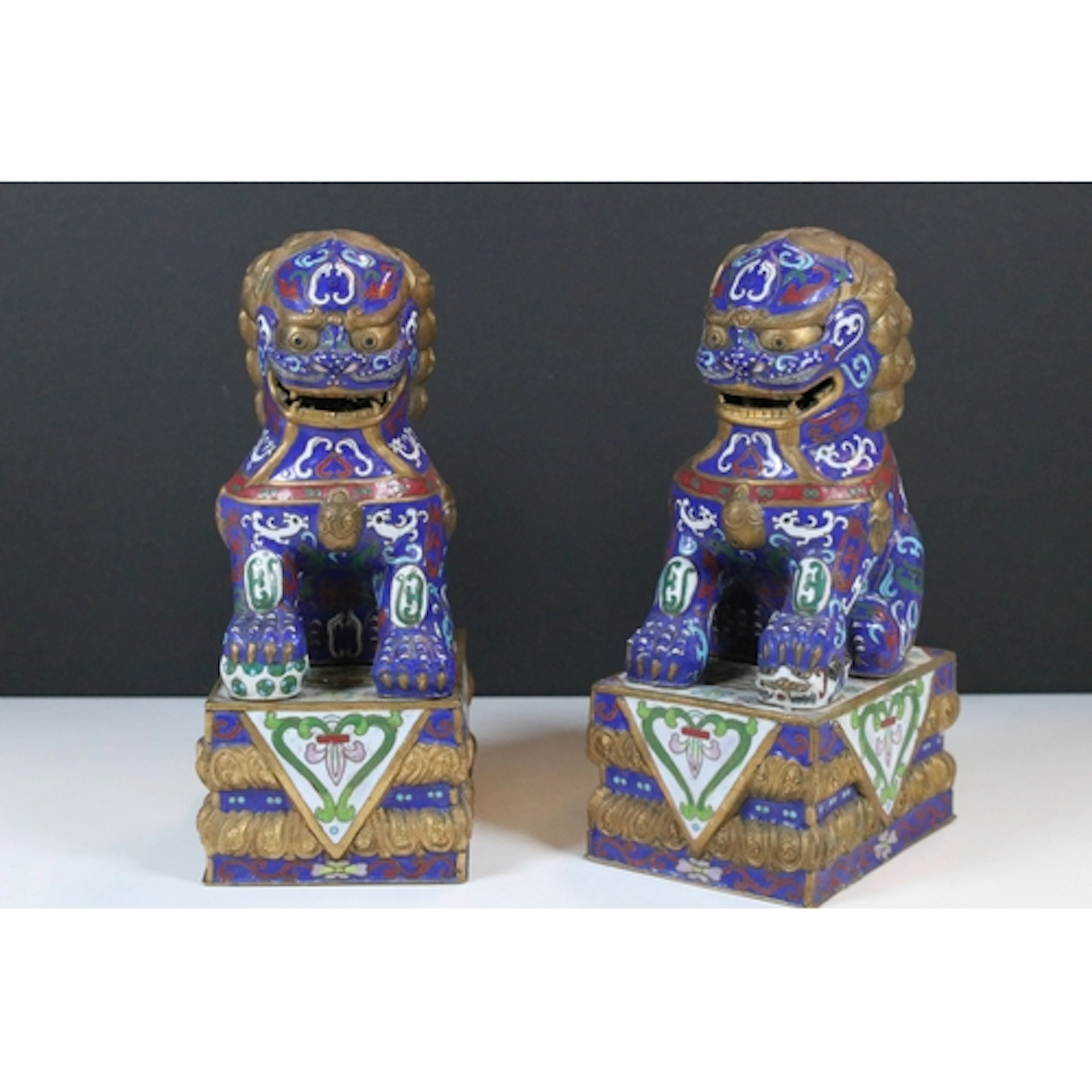 Pair of 20th century Chinese cloisonne foo dogs, modelled in...