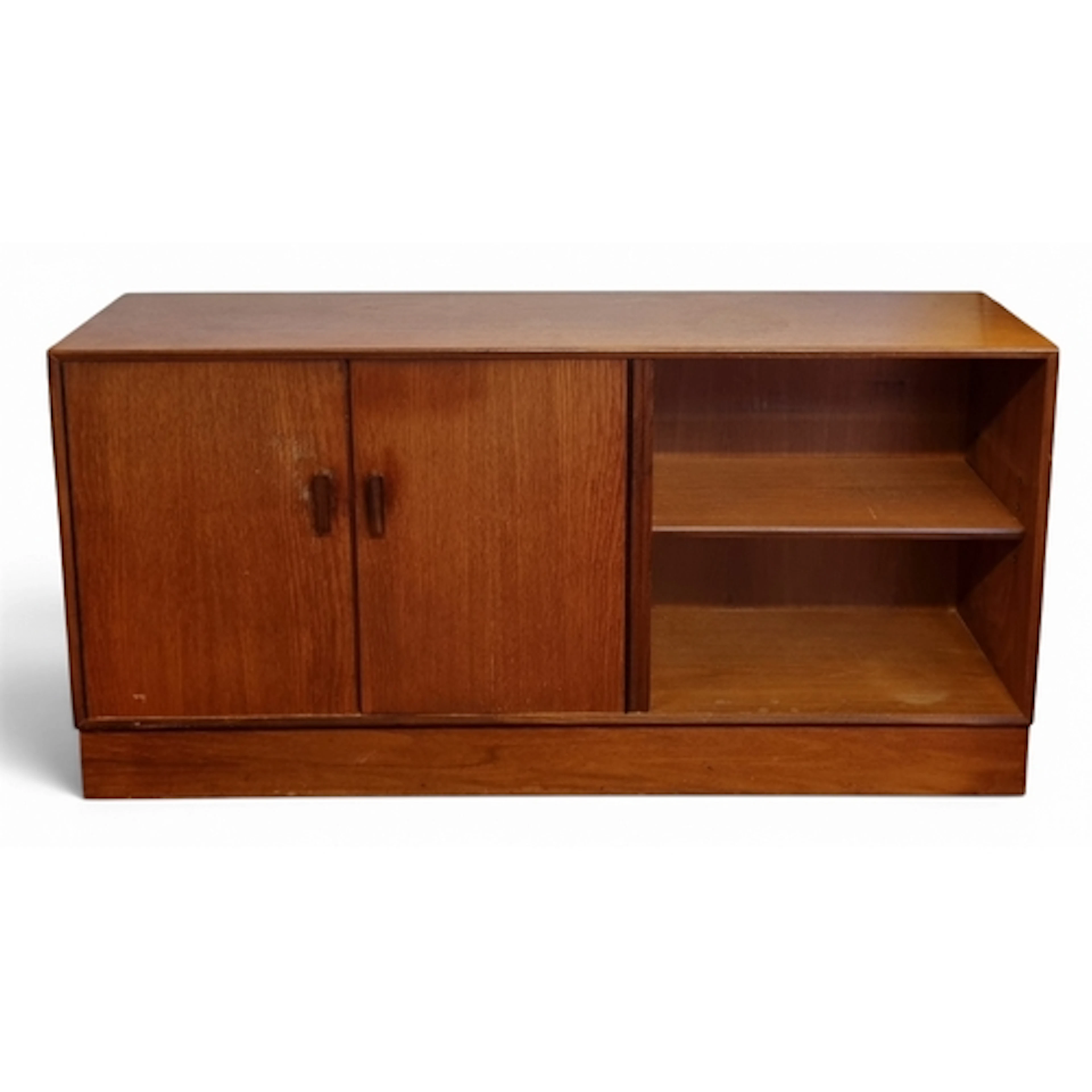 A neat mid Century Teak low Bookcase with twin panel doors. ...