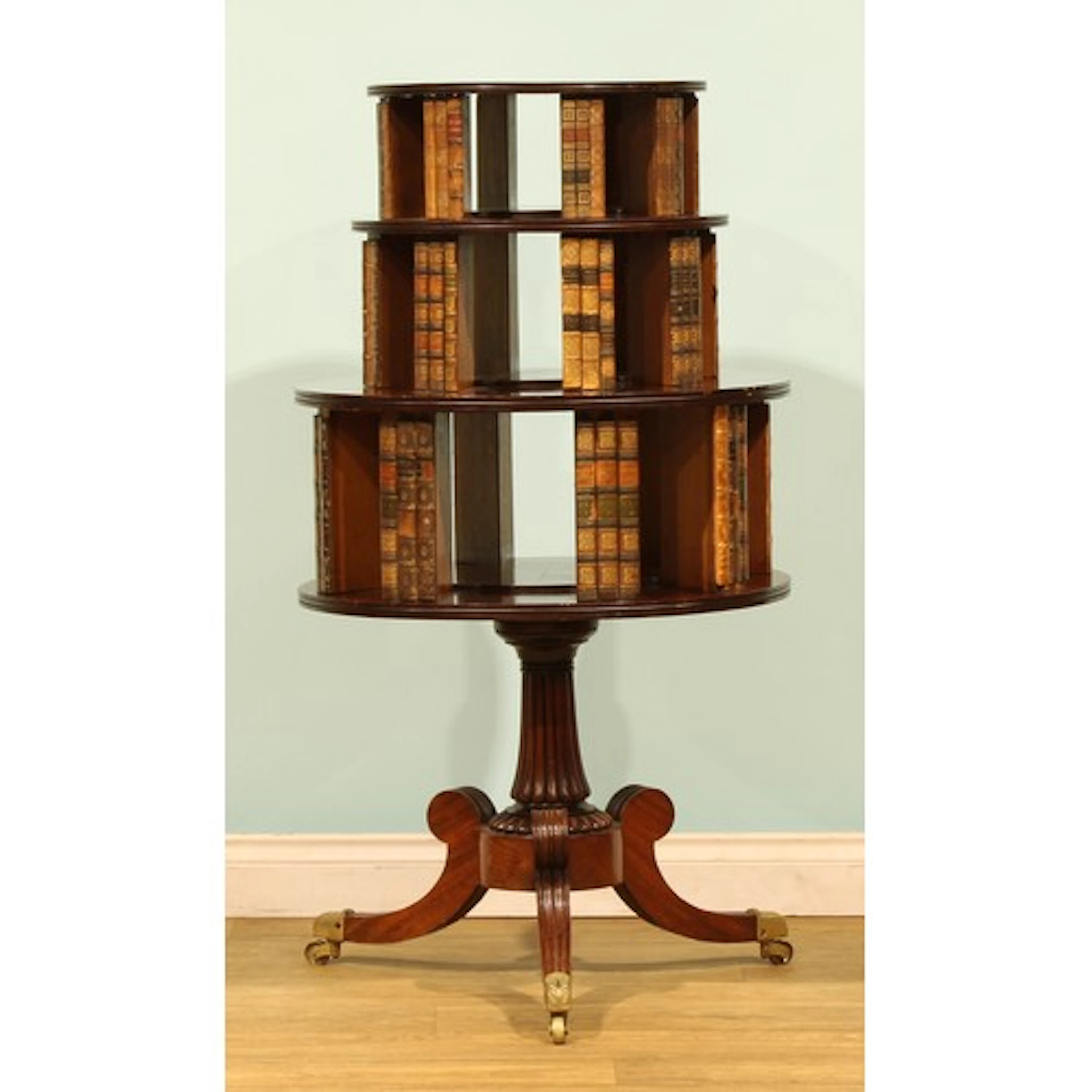 A George IV mahogany three-tier tripod revolving bookcase, c...