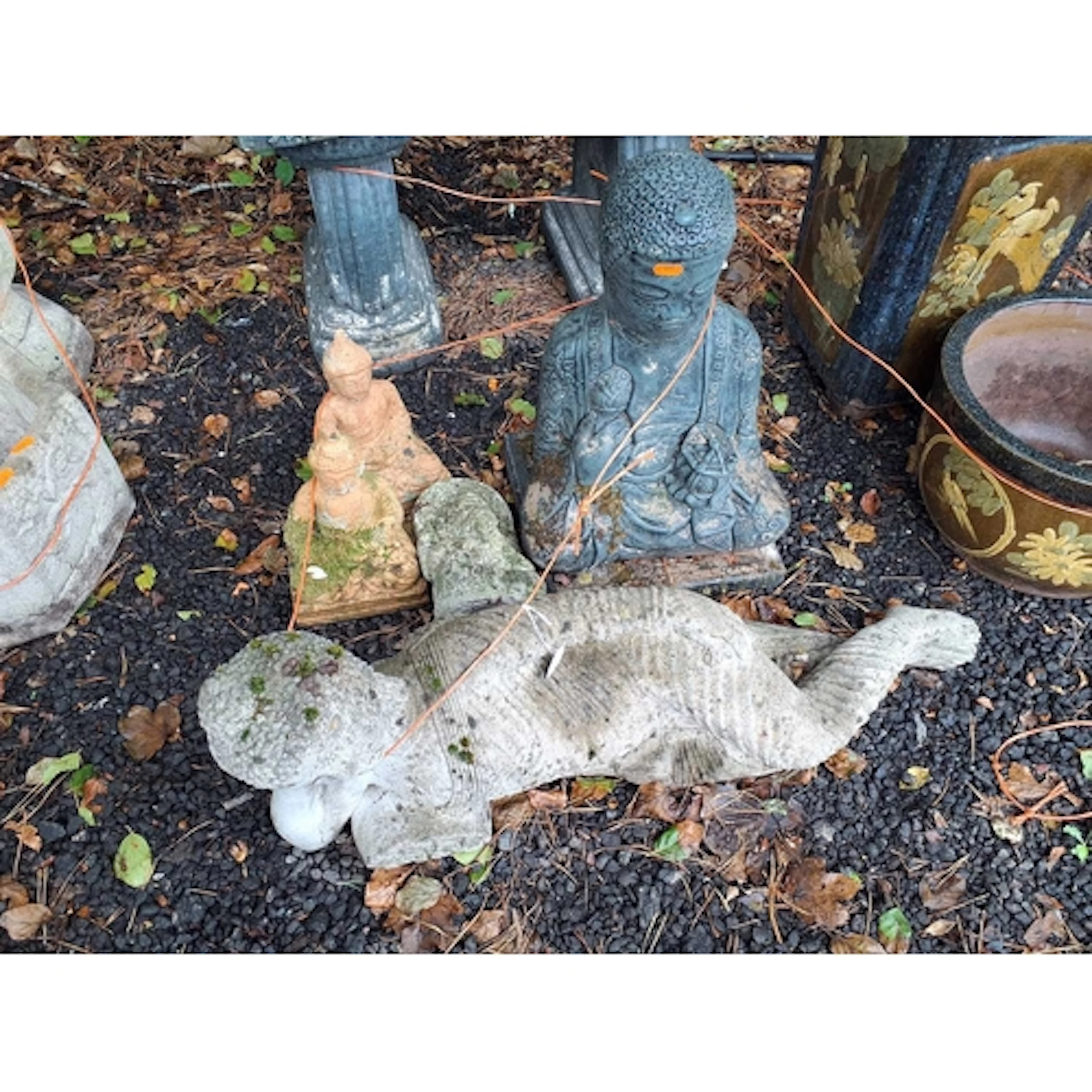 A COLLECTION OF CONCRETE ORIENTAL AND HINDU DEITY FIGURES, i...