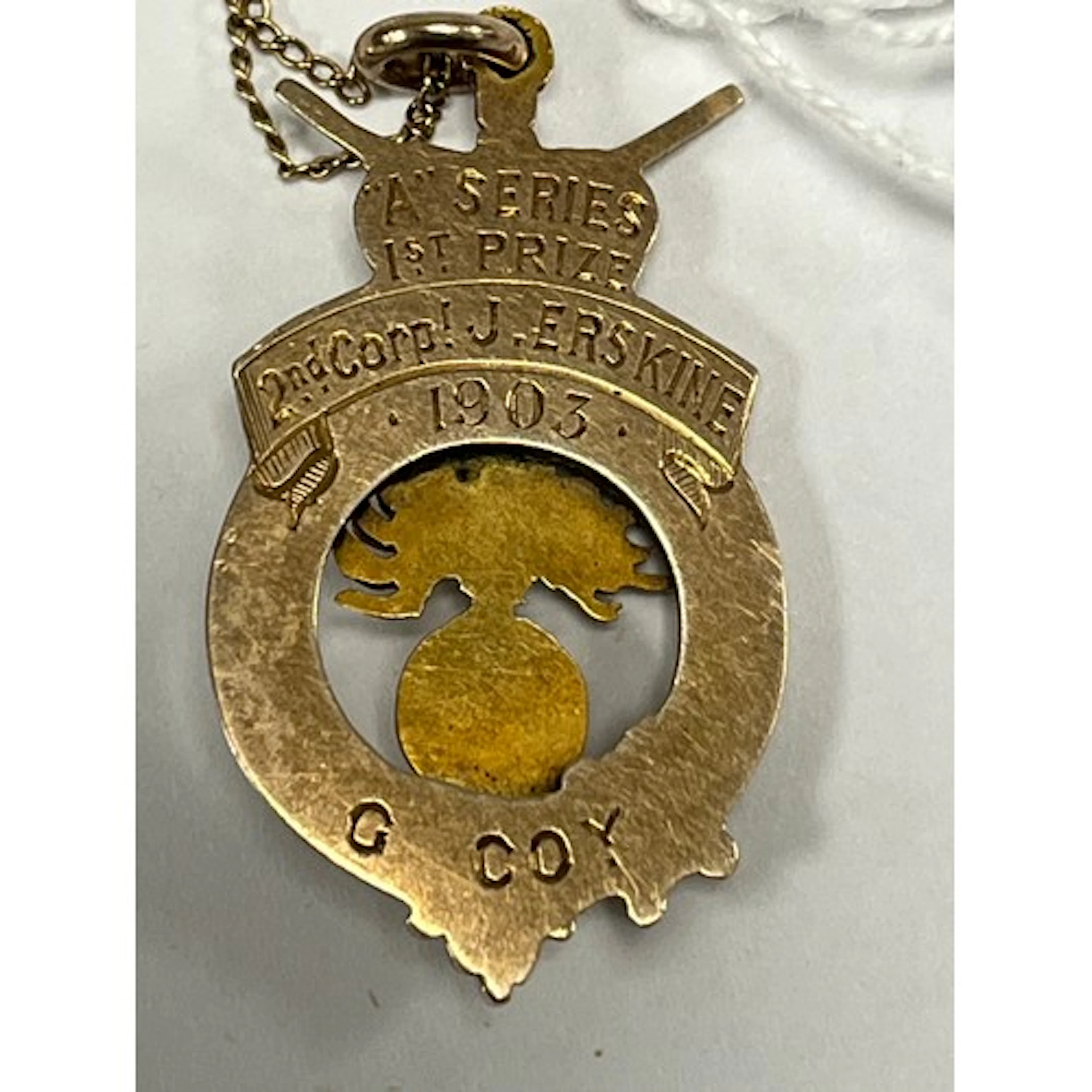 Military yellow metal medal dated 1903 with 9ct gold ch...