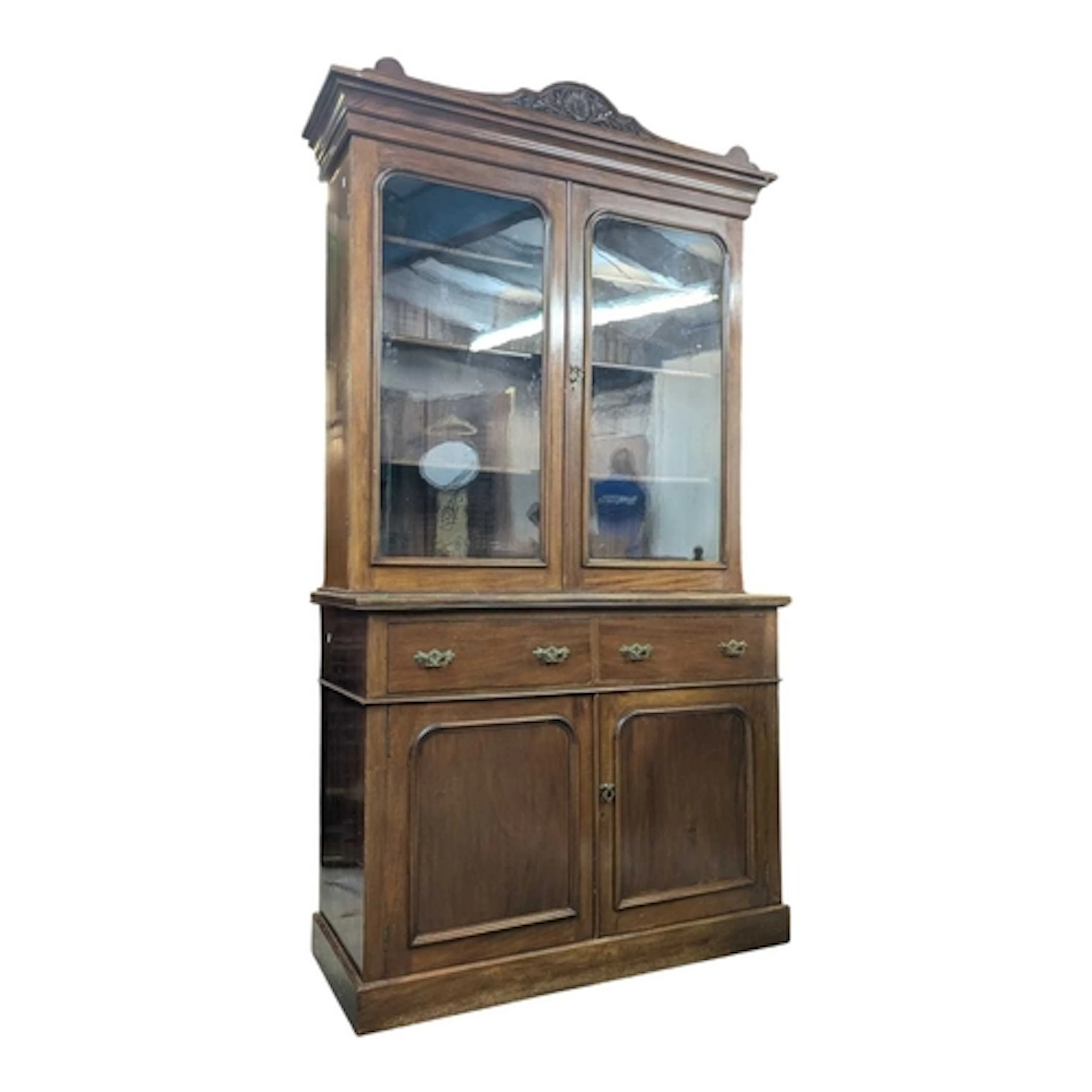 An Edwardian walnut library bookcase cupboard. Raised on a p...