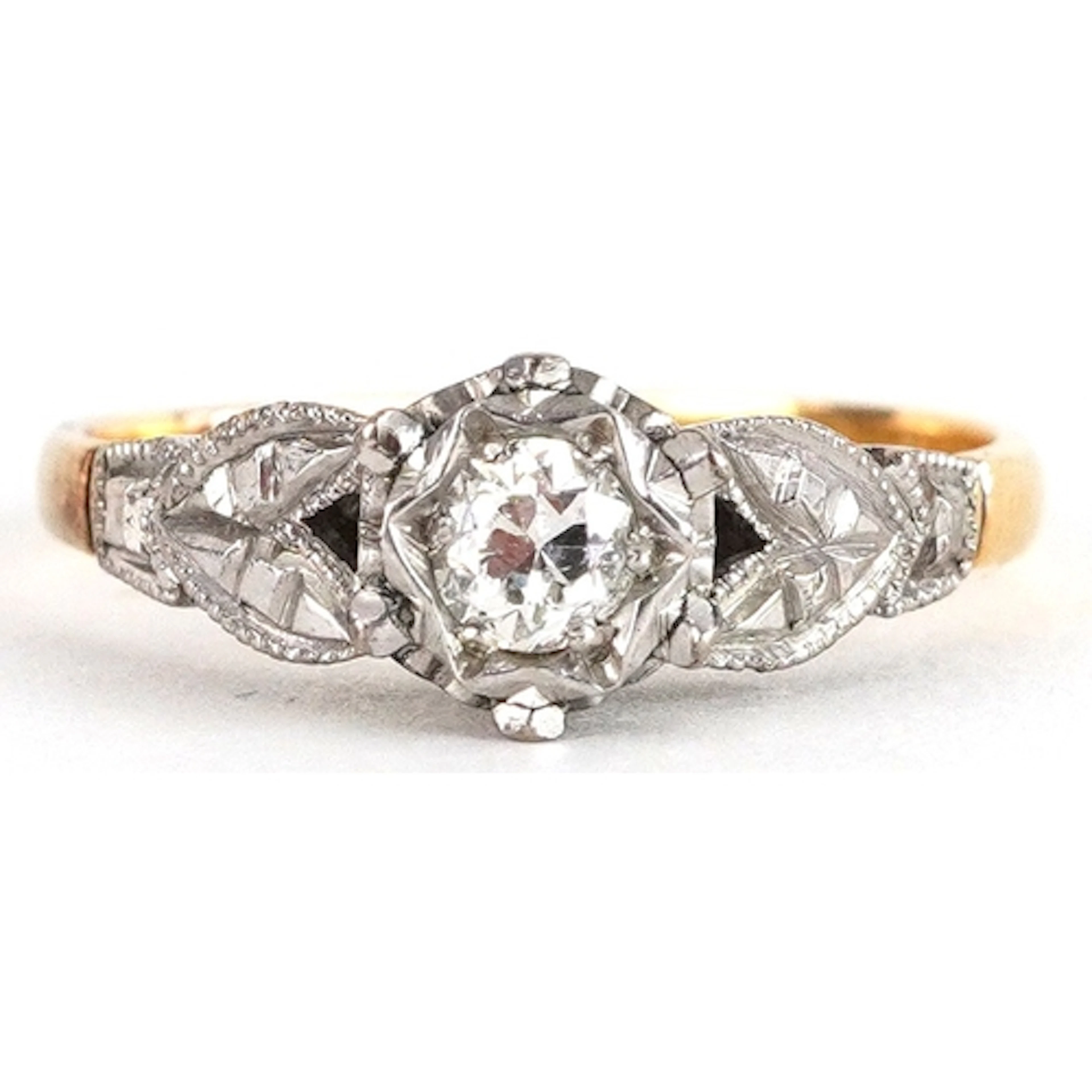 18ct gold and platinum diamond solitaire ring, the diamond a...