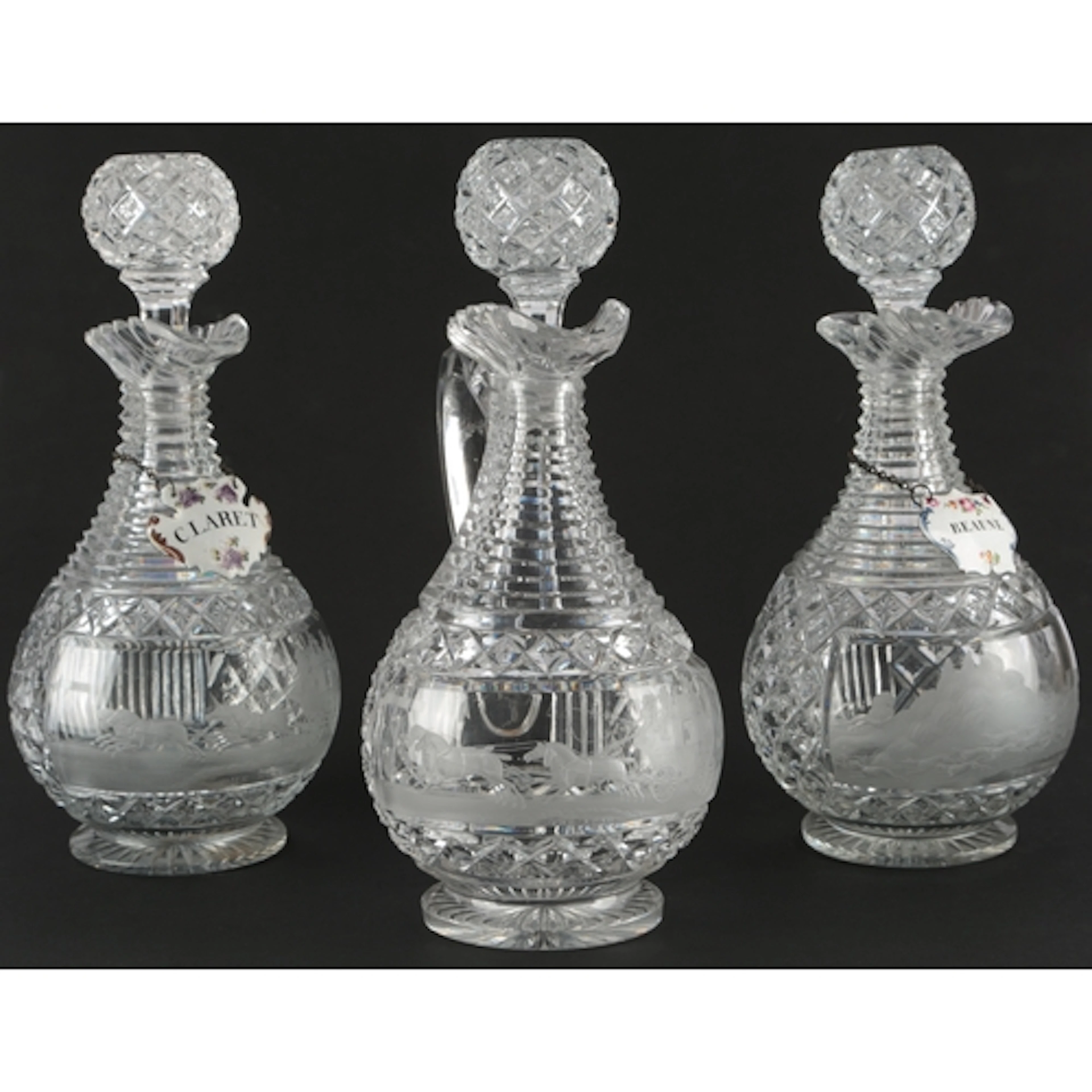 A set of three Regency cut glass decanters, engraved by W. H...