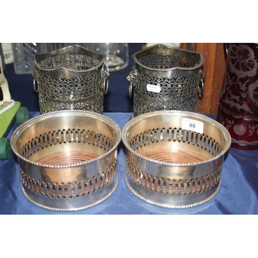 Pair of silver plated wine slides and another pair with lion...