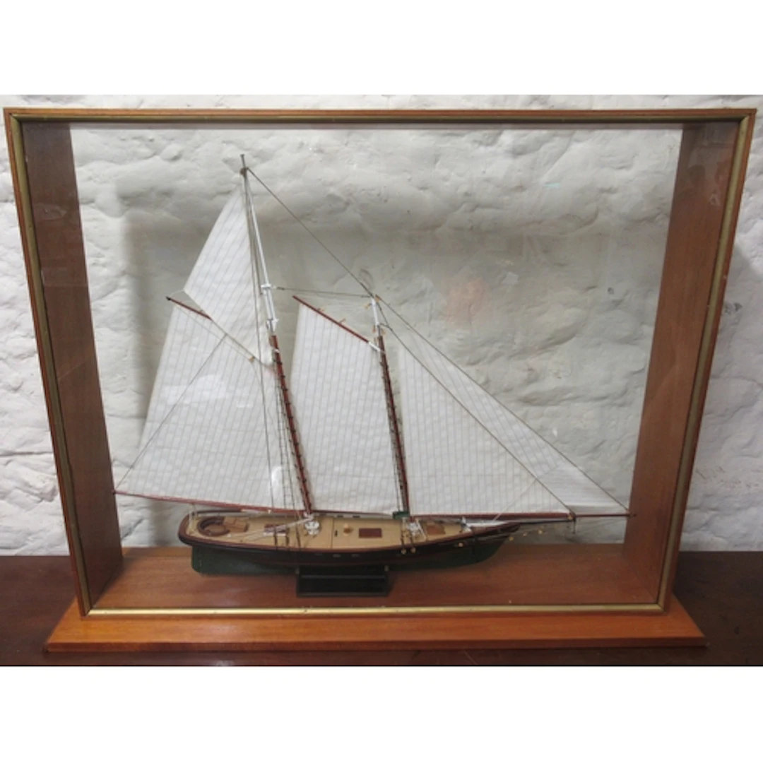 Modern model of a vintage gaff rigged ketch, in a glass case