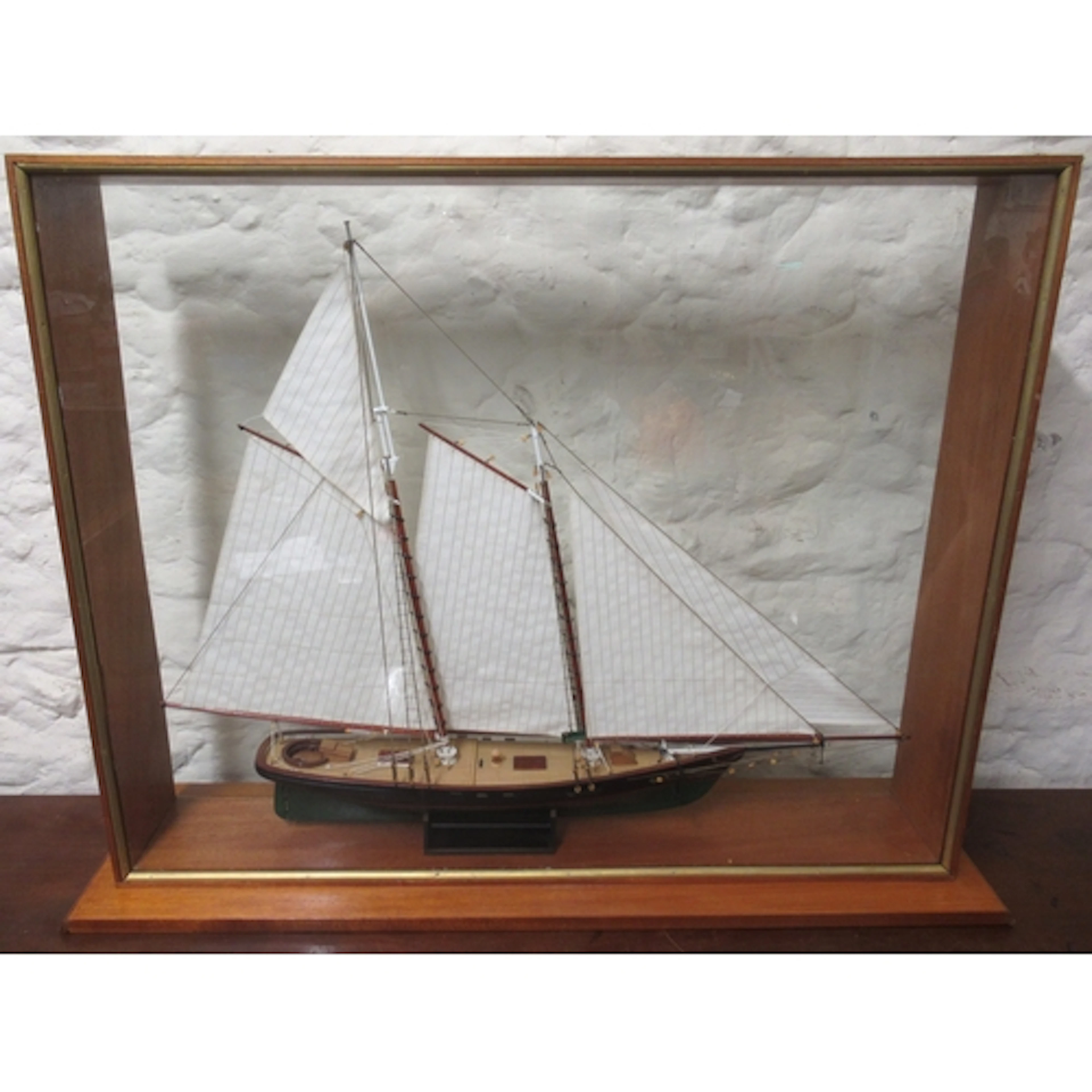 Modern model of a vintage gaff rigged ketch, in a glass case