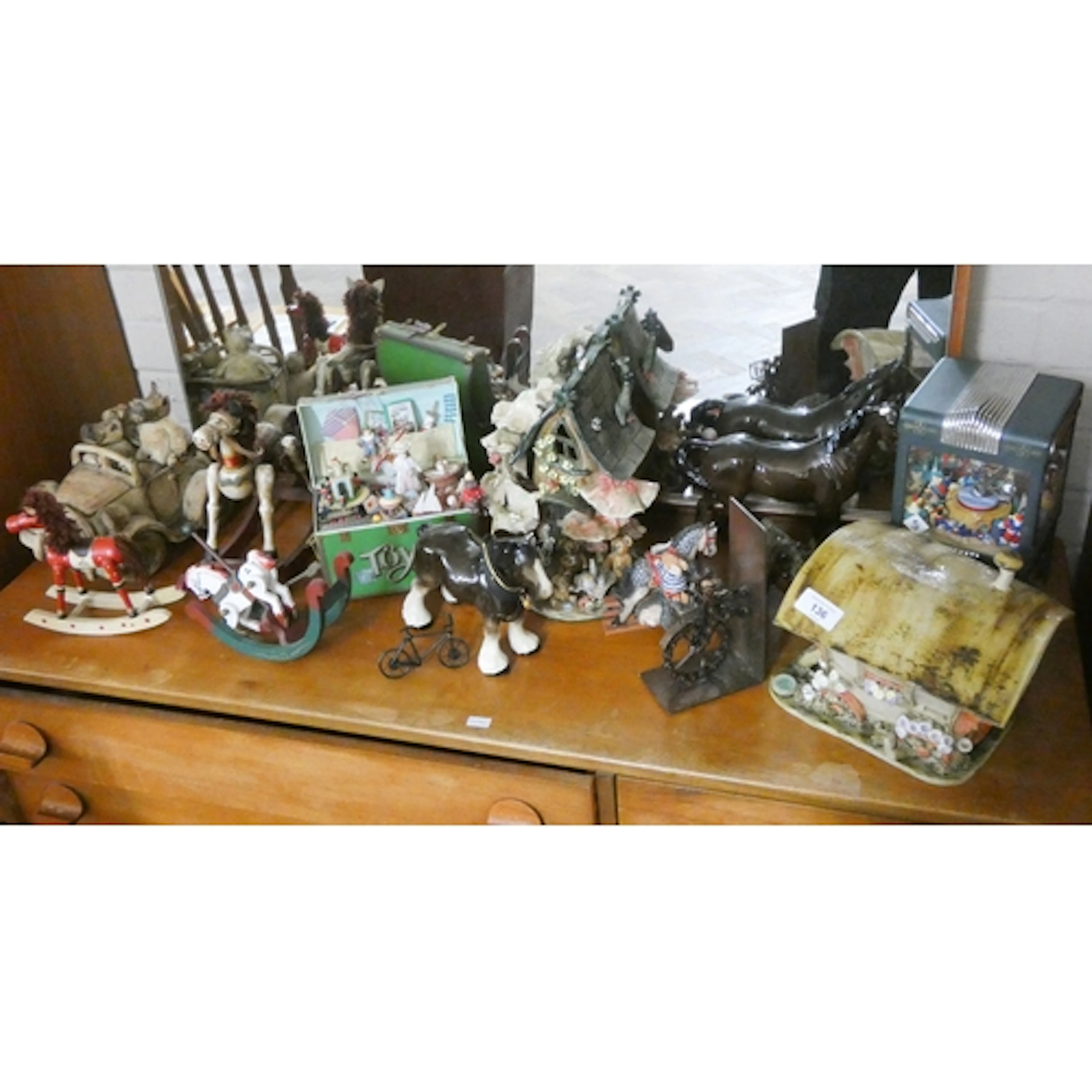 A collection of art pottery sculptures of fairy cottages, te...