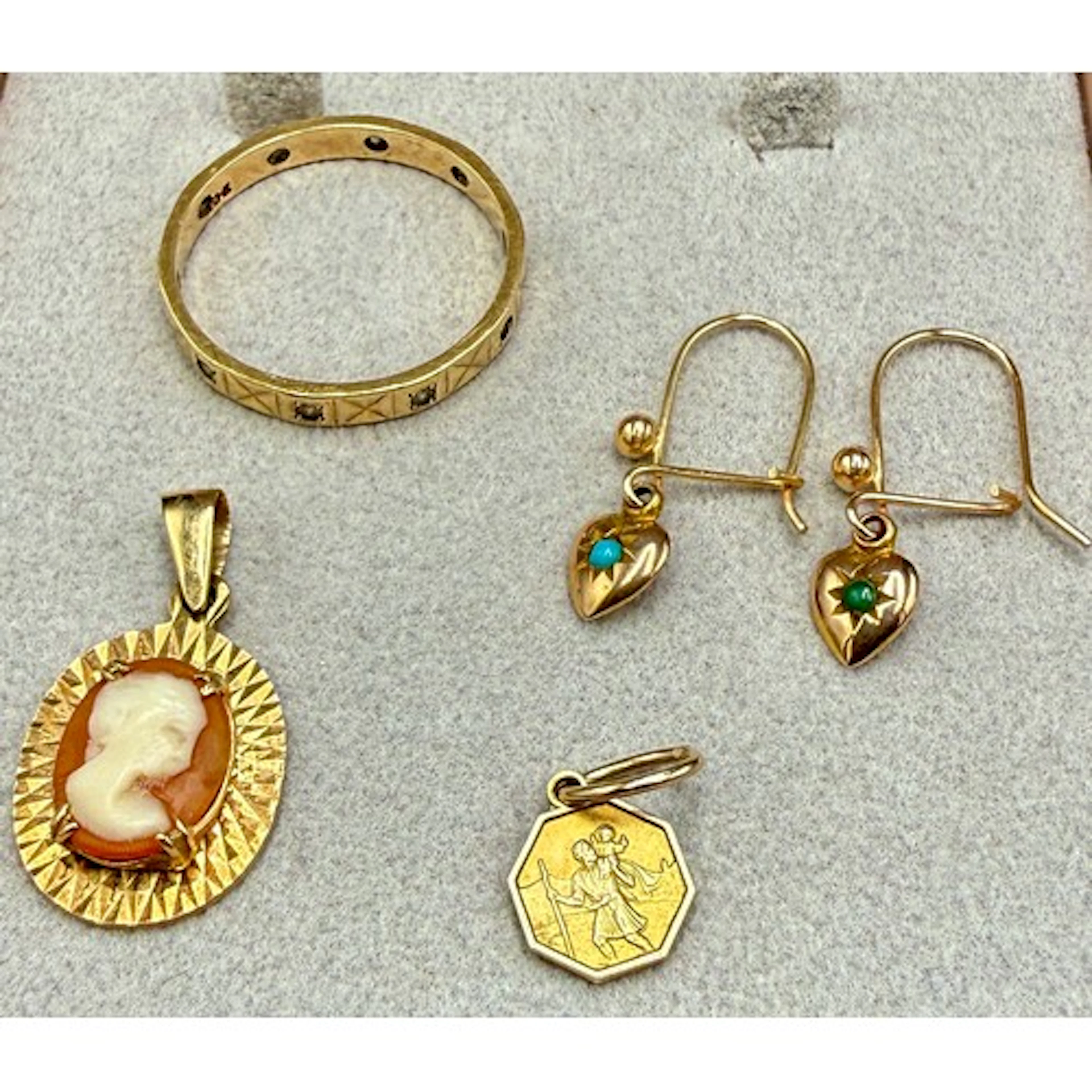 Nine carat gold to include eternity ring, Saint Christopher ...