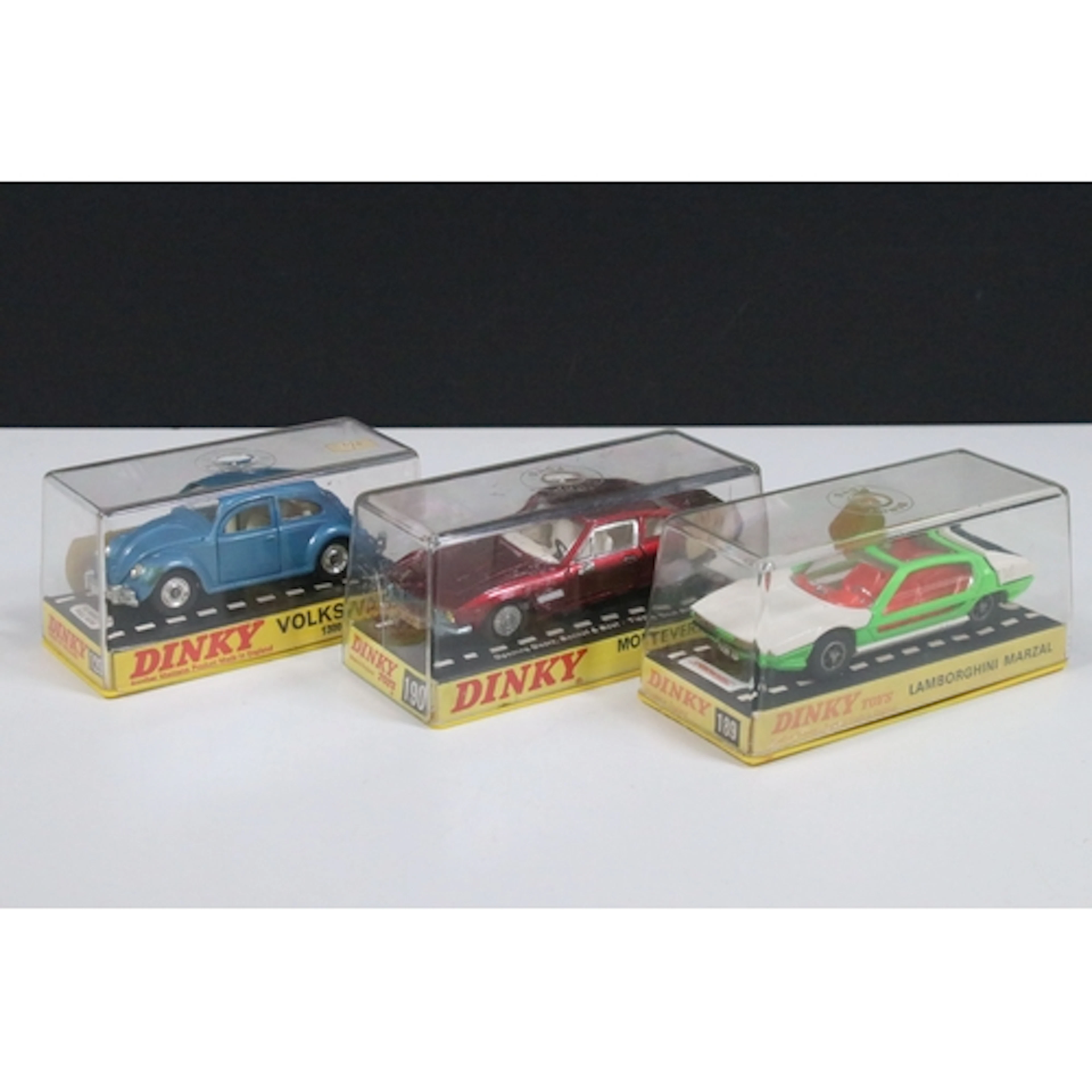 Three cased Dinky diecast models to include 129 Volkswagen 1...