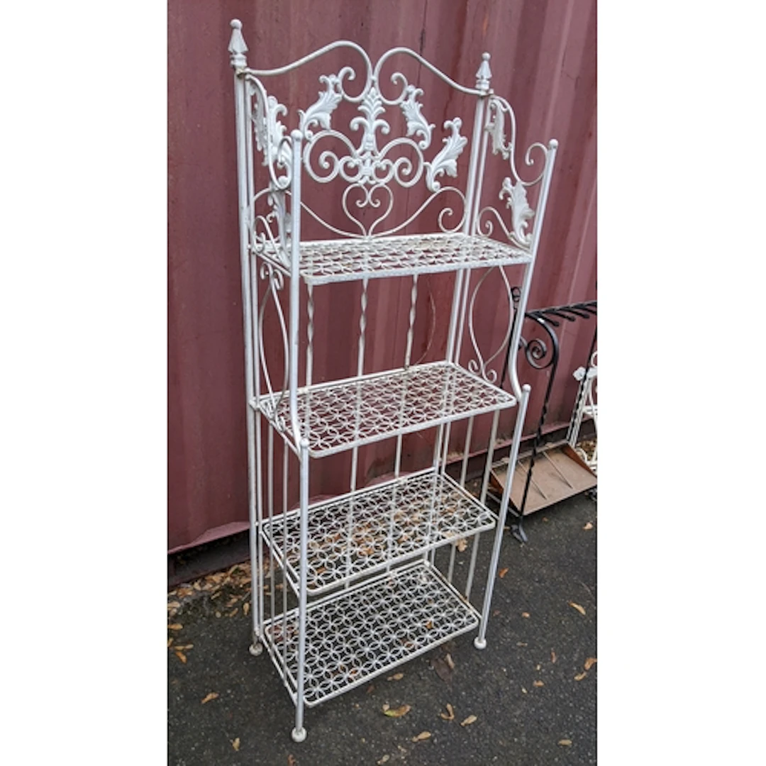 A vintage white painted cast iron folding four tier garden p...