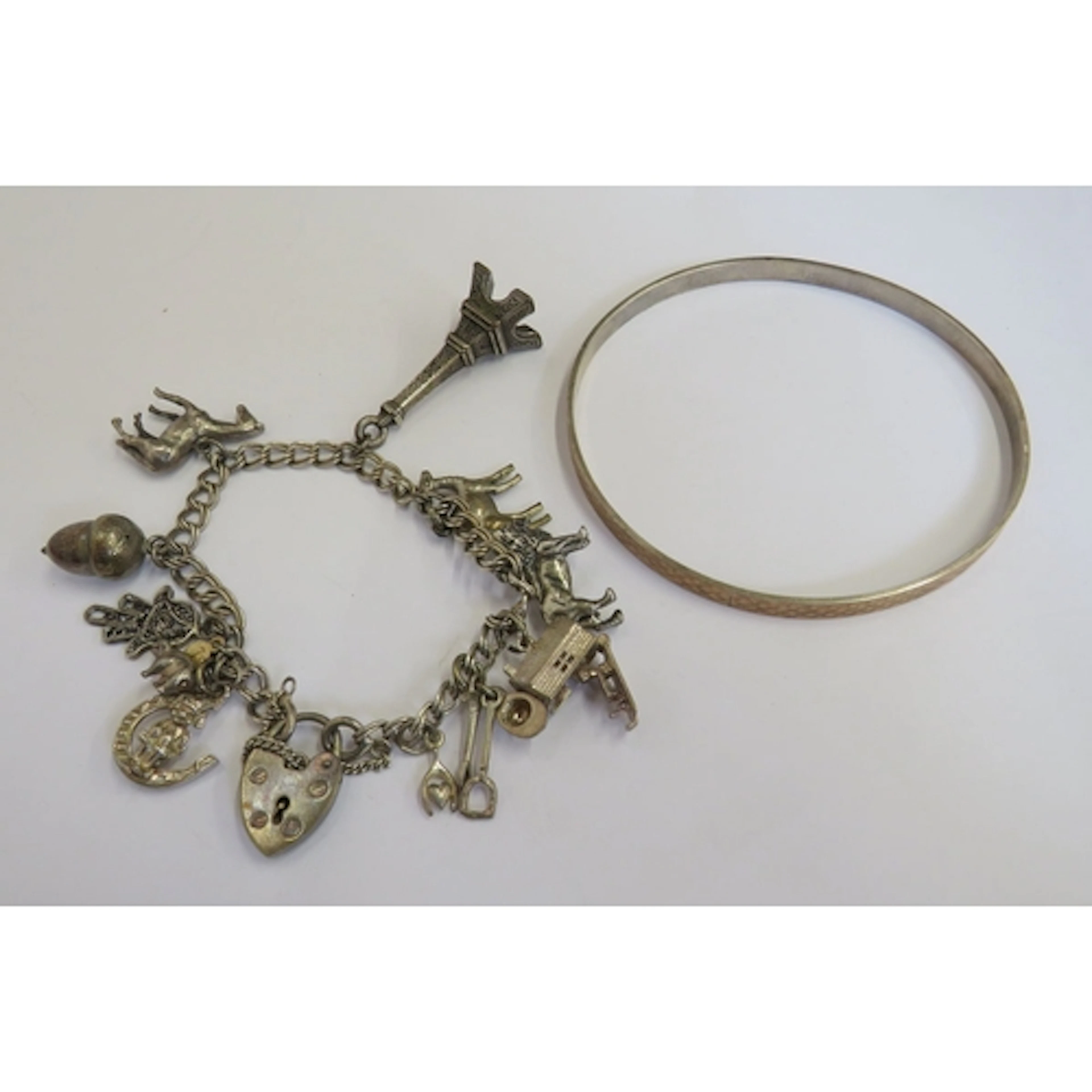 Silver Charm Bracelet with assorted charms, horses, eiffel t...