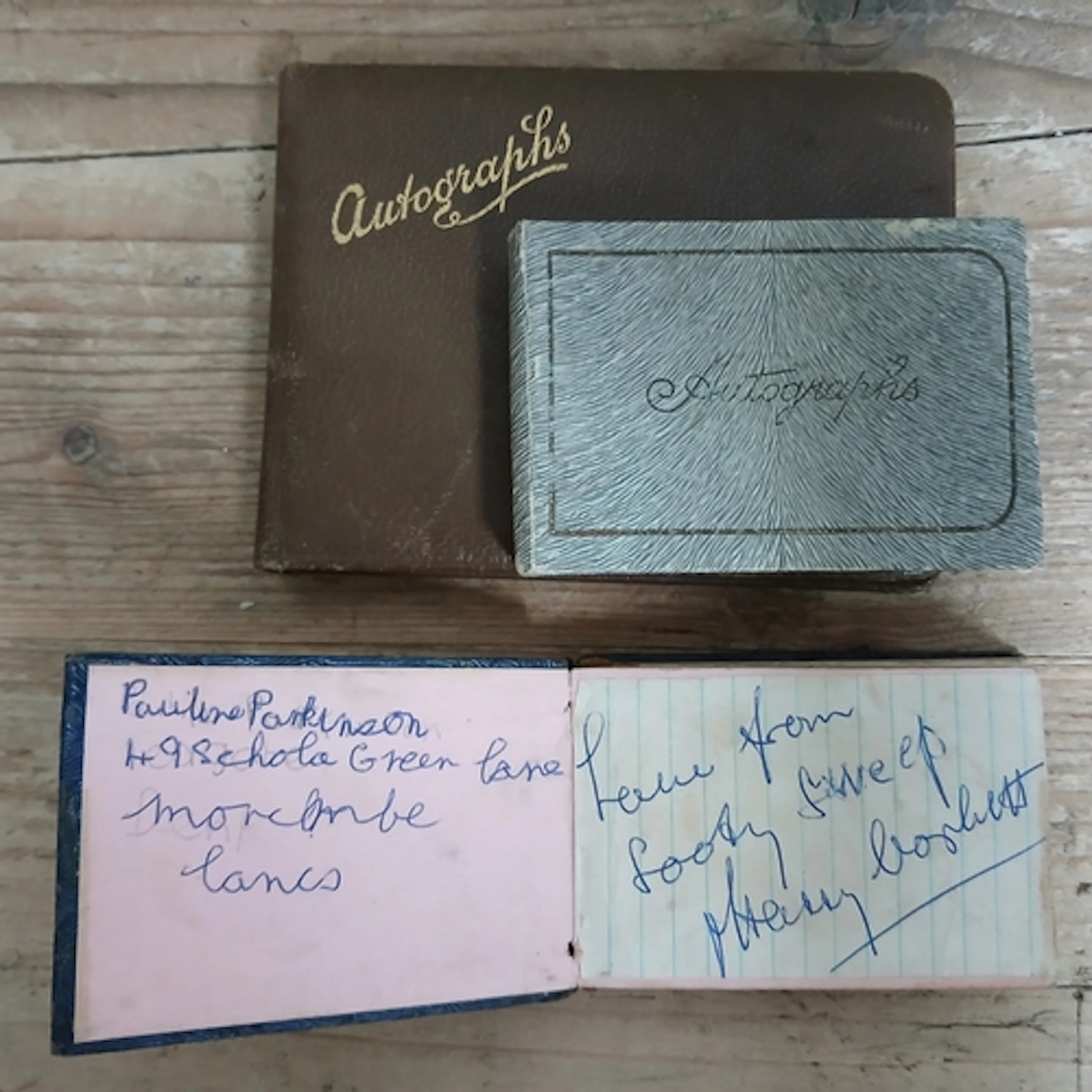 A group of three autograph albums; one containing various si...