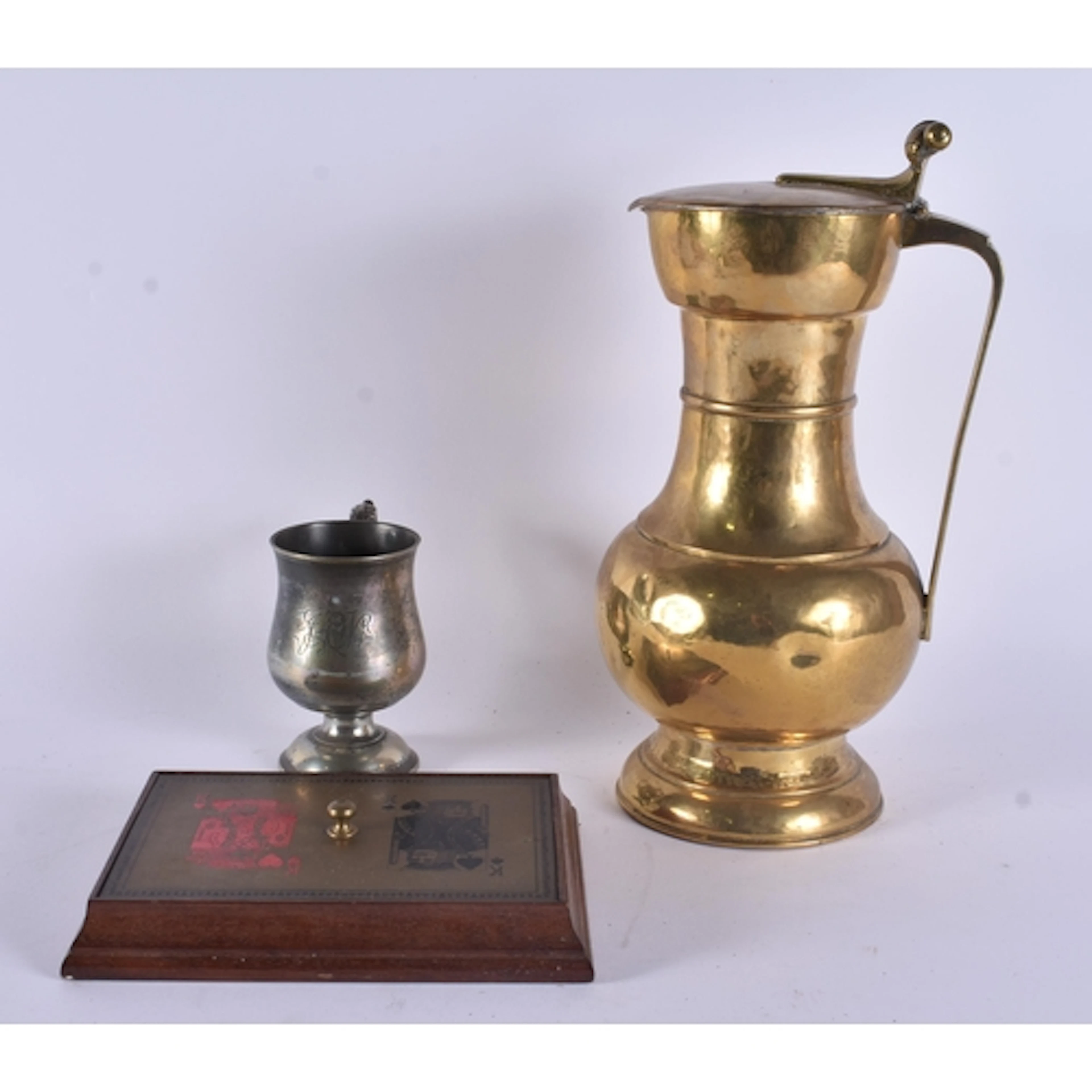 AN ANTIQUE BRASS TAPPIT HEN together with a mug and card gam...