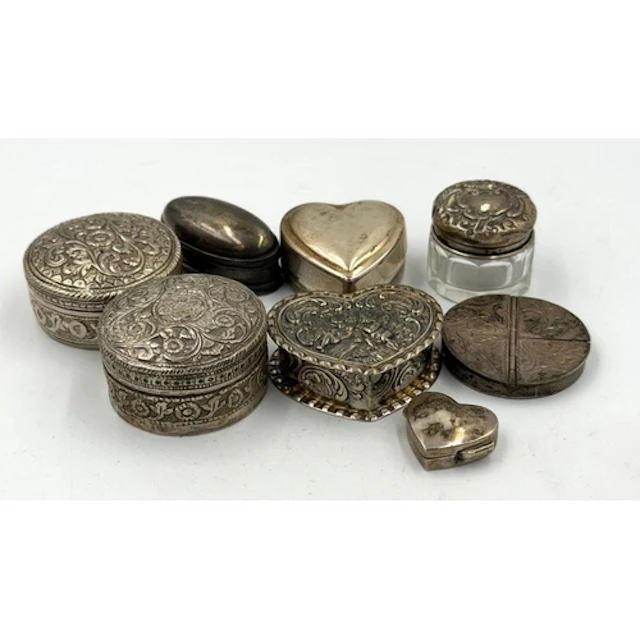 A selection of eight silver curios to include pill boxes etc...