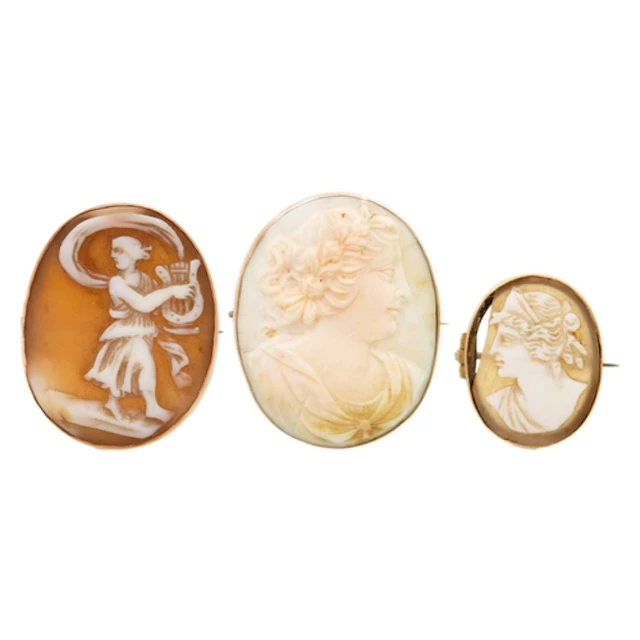A selection of three shell cameo brooches set in 9k gold. In...