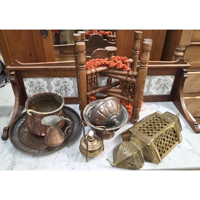 A Middle Eastern copper table on stand; a similar lidded pot...