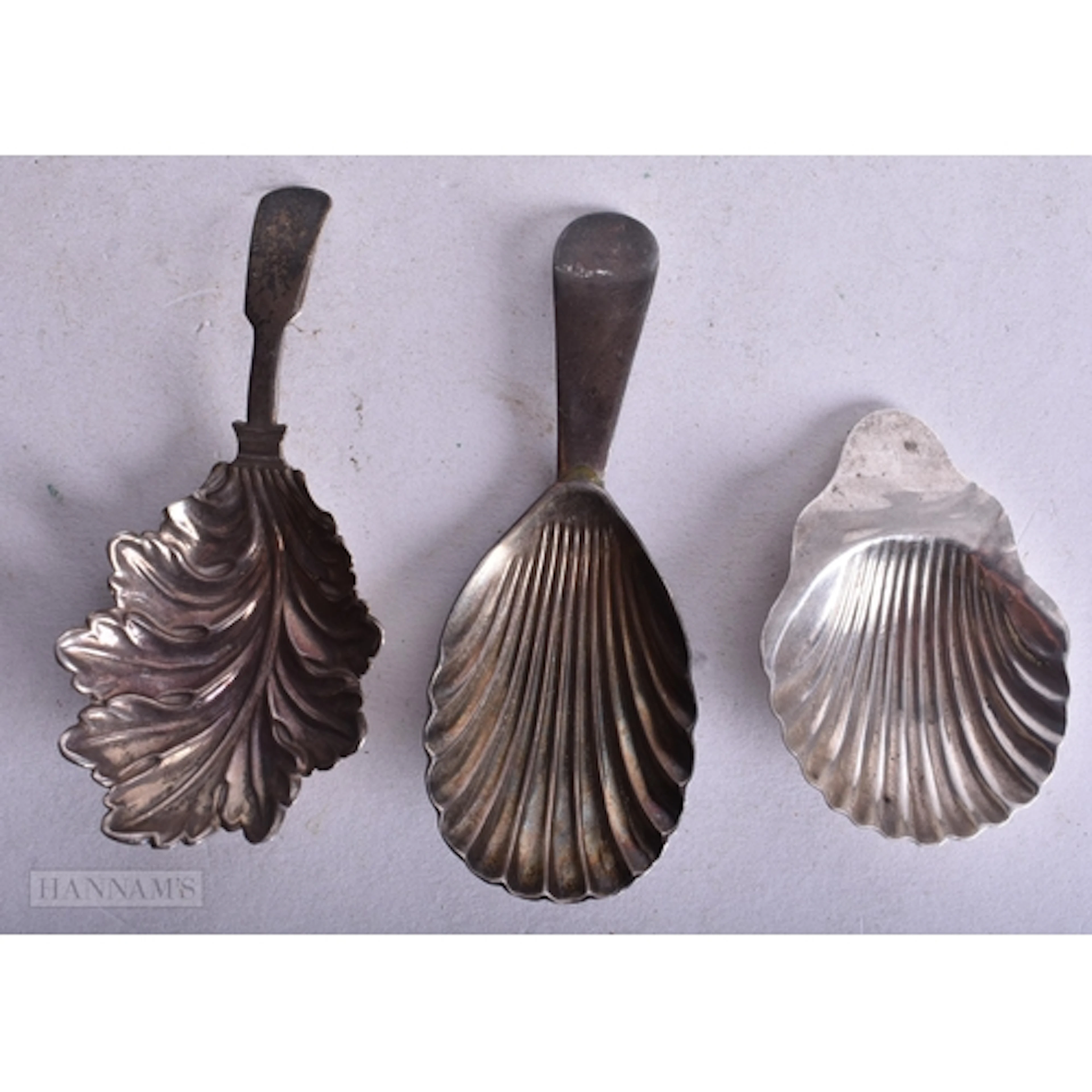 THREE ANTIQUE SILVER CADDY SPOONS. 30 grams. (3)