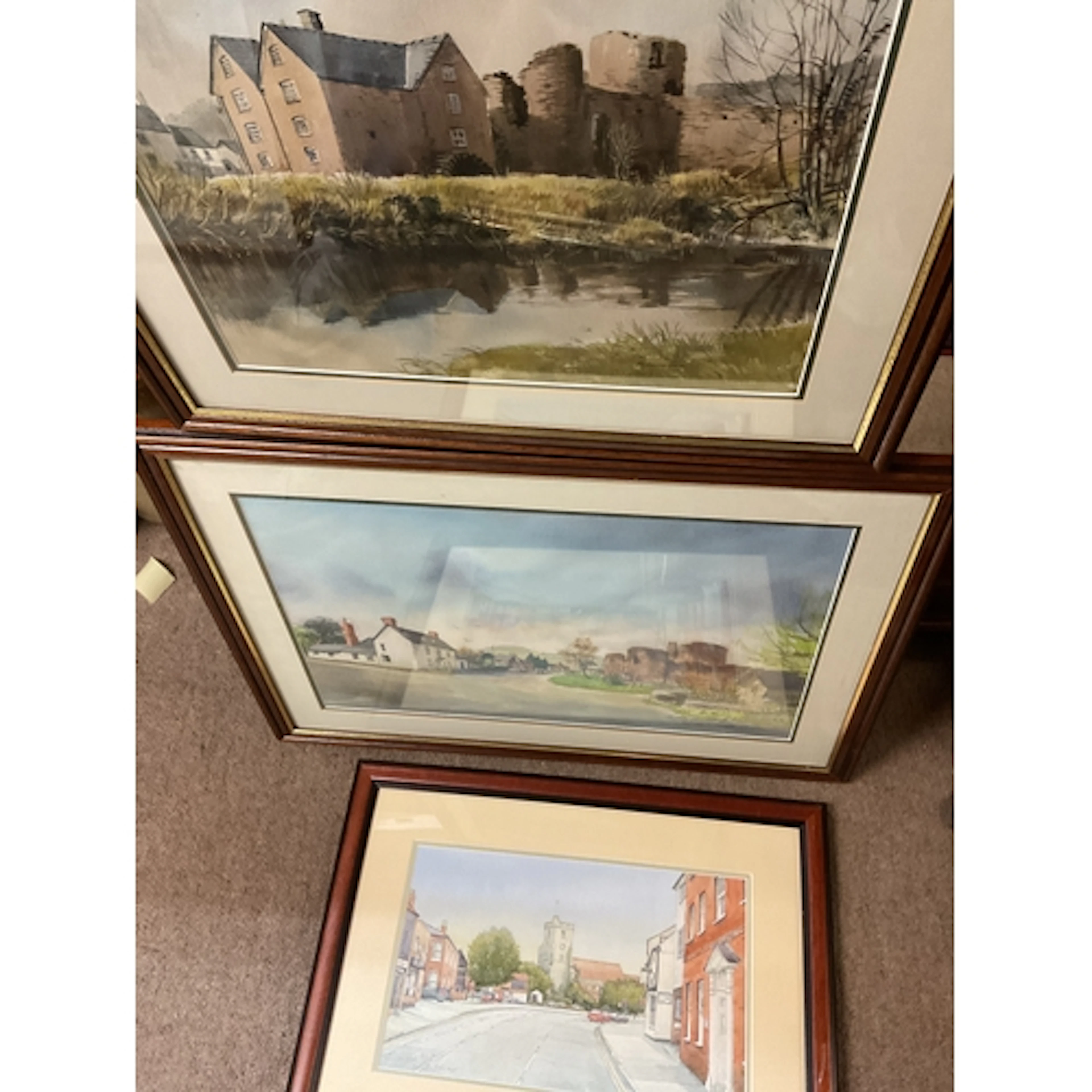 Three framed and glazed watercolours of town scenes. NO RES...