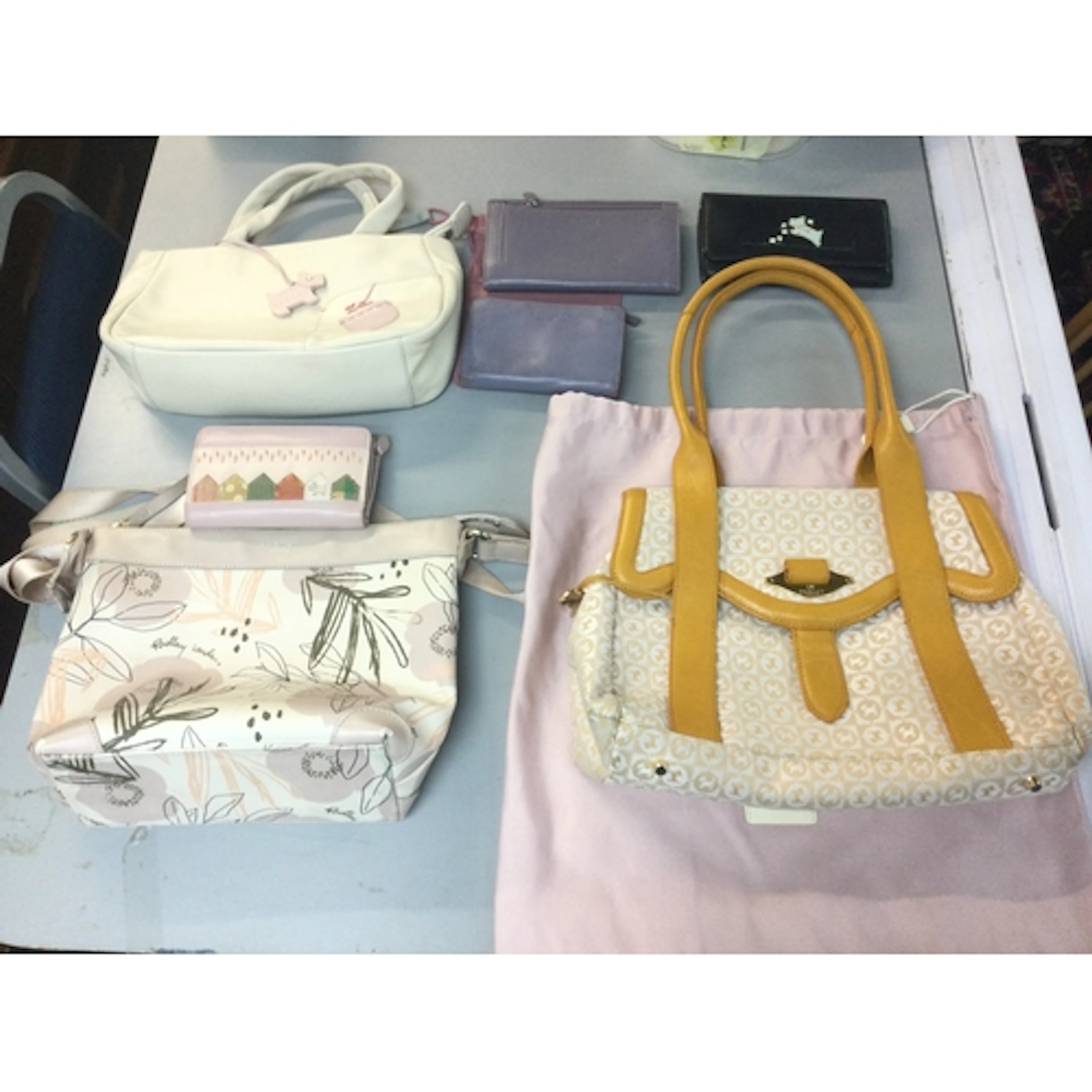 Three Radley bags and four purses