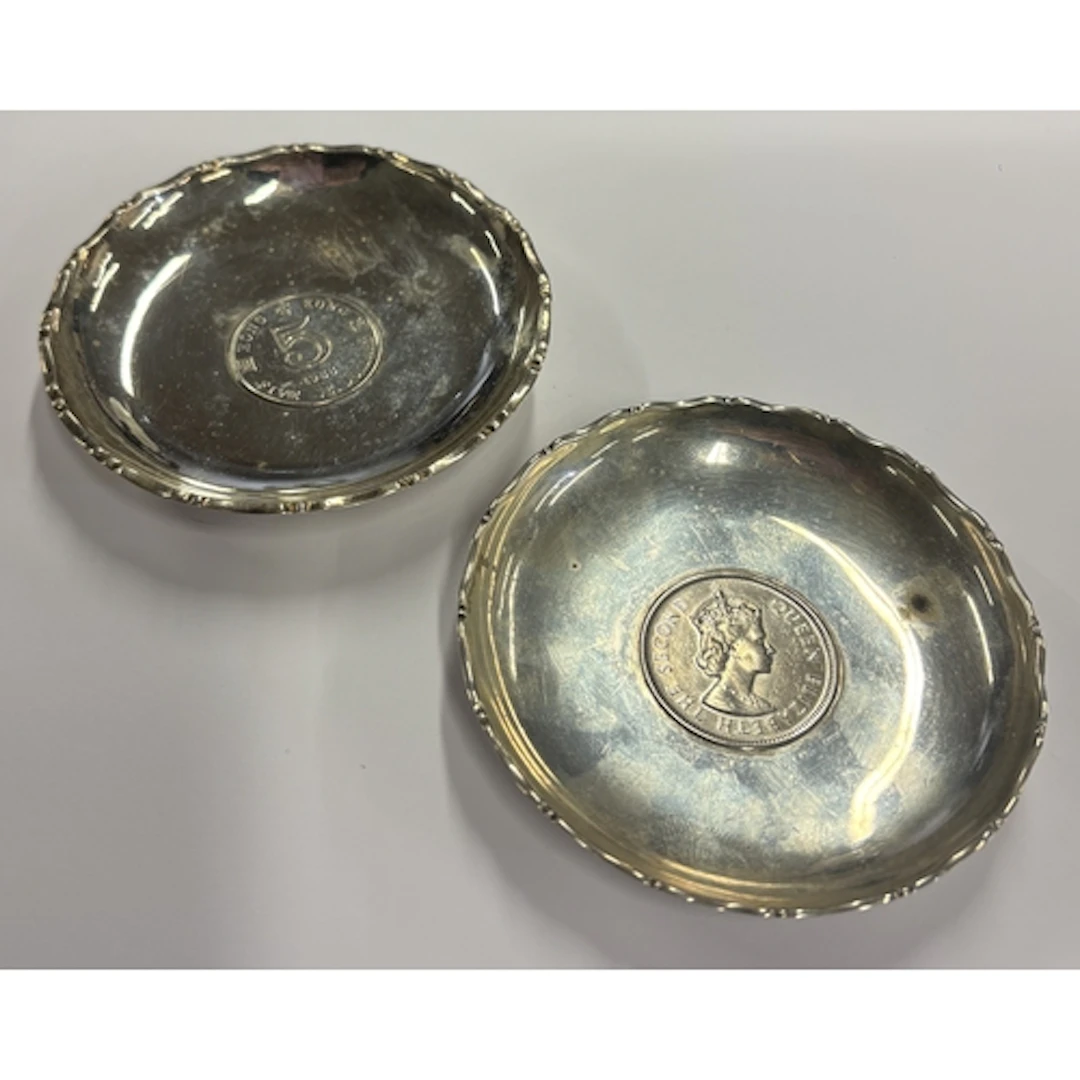 A pair of small Chinese silver pin dishes set with coins. Ap...