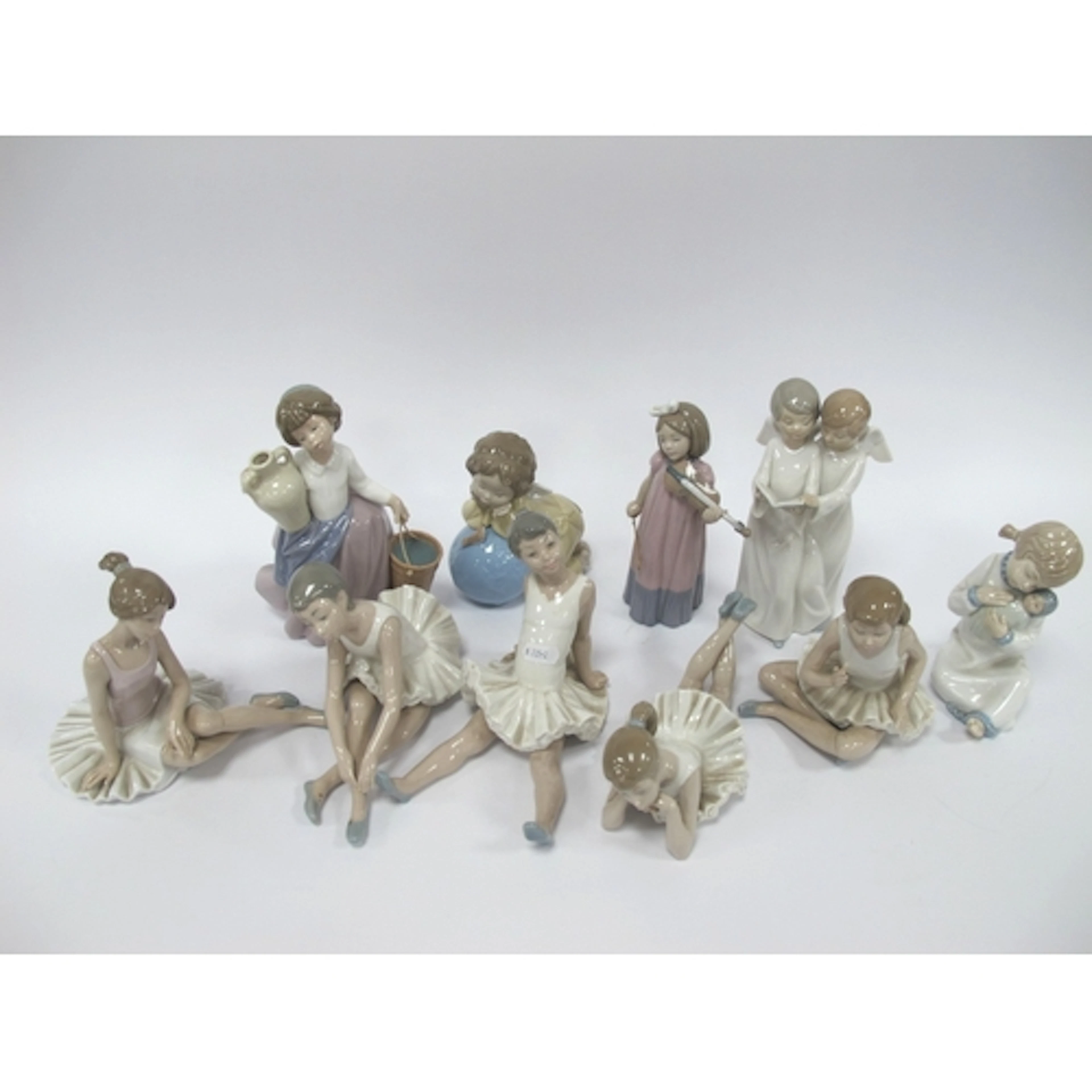 Ten Lladro and NAO Porcelain Figures, including girls, child...